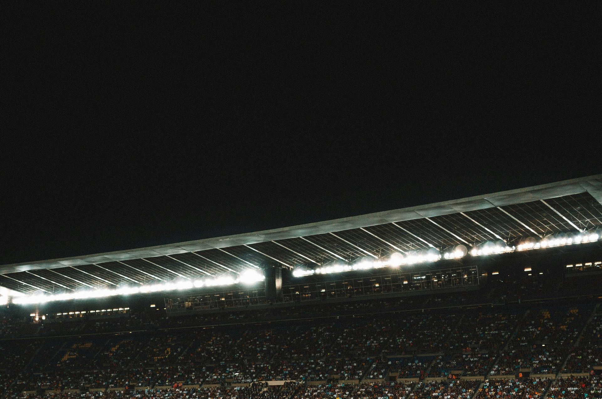 green soccer field inside stadium