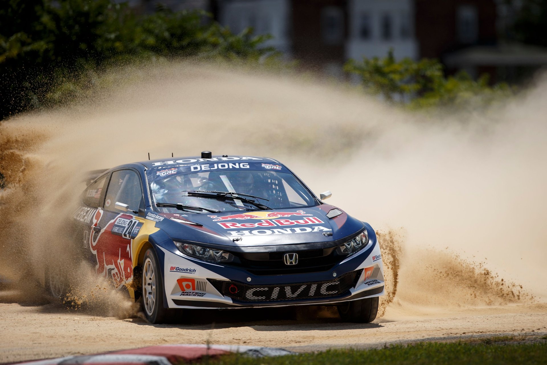 Race Car in Action with Mitchell DeJong as the driver of his Honda Racing Rallycross car in the dirt