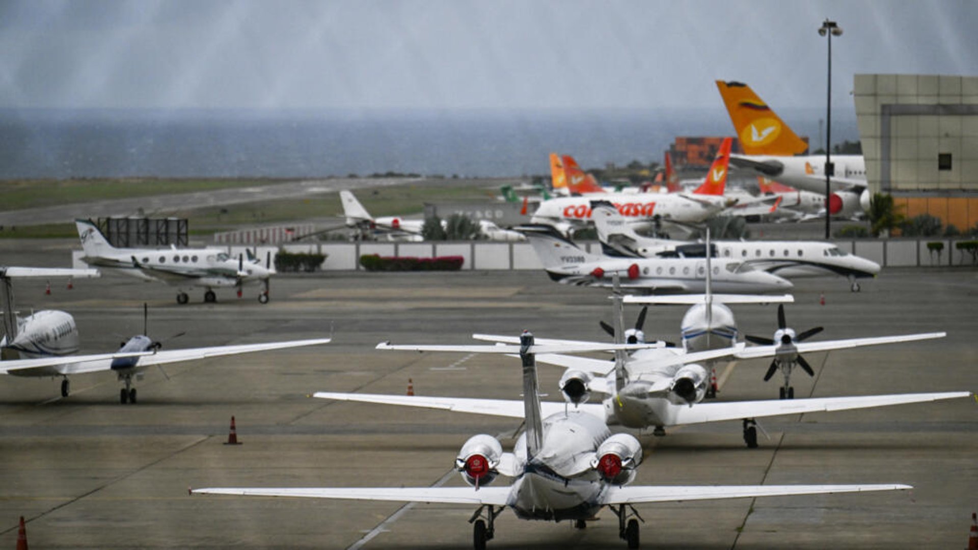an abstract photo of a curved building with a blue sky in the background