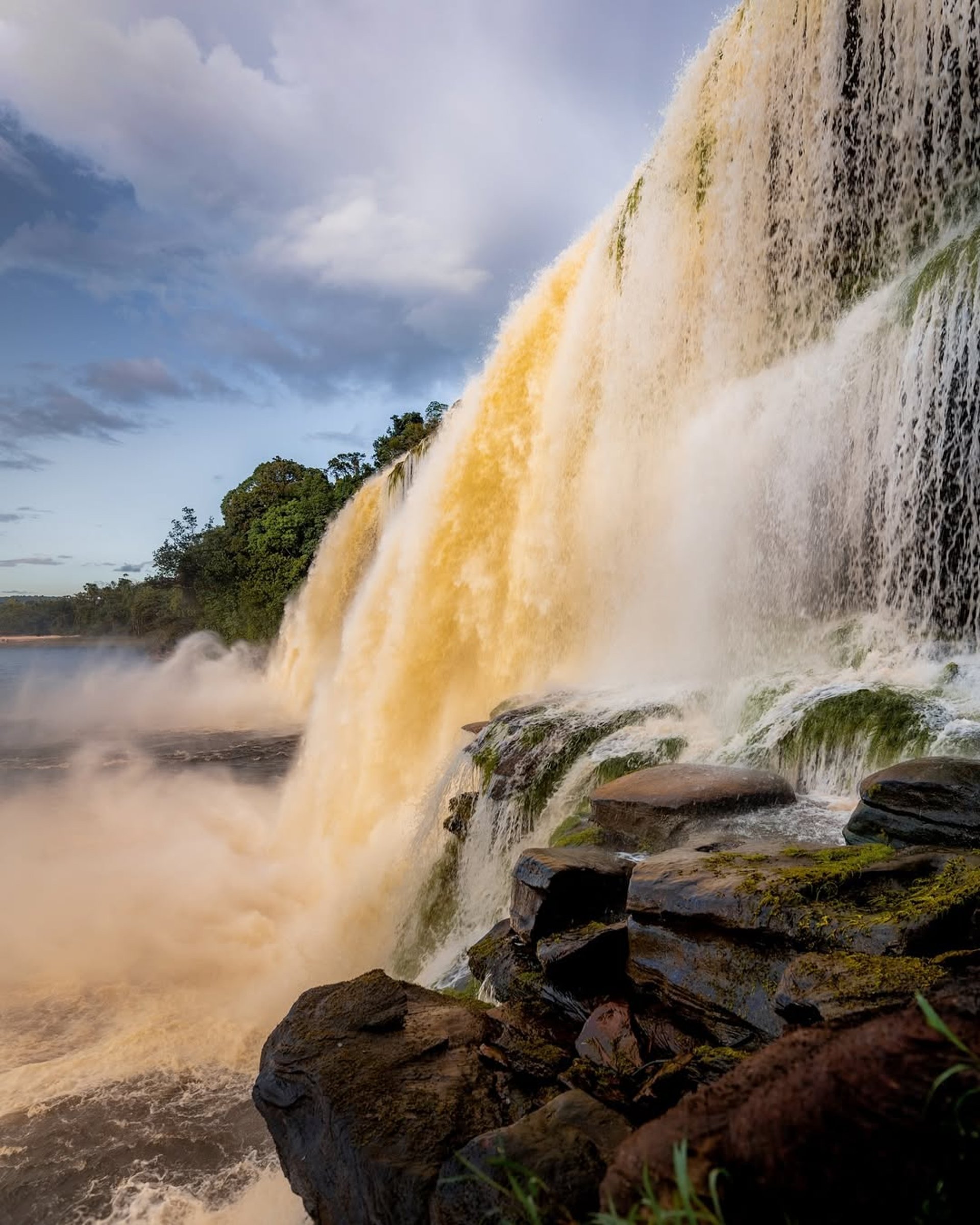 an abstract photo of a curved building with a blue sky in the background