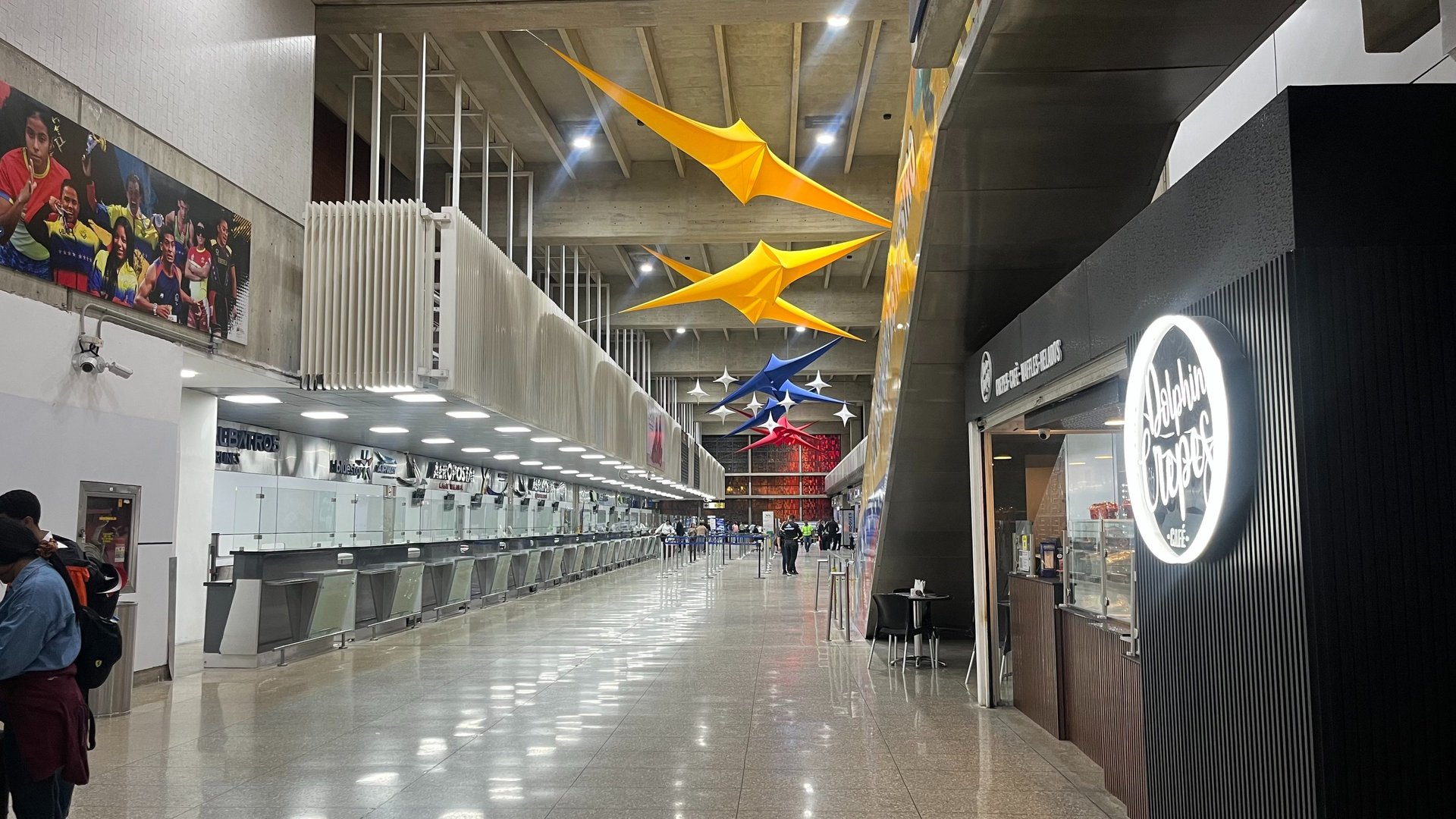 an abstract photo of a curved building with a blue sky in the background