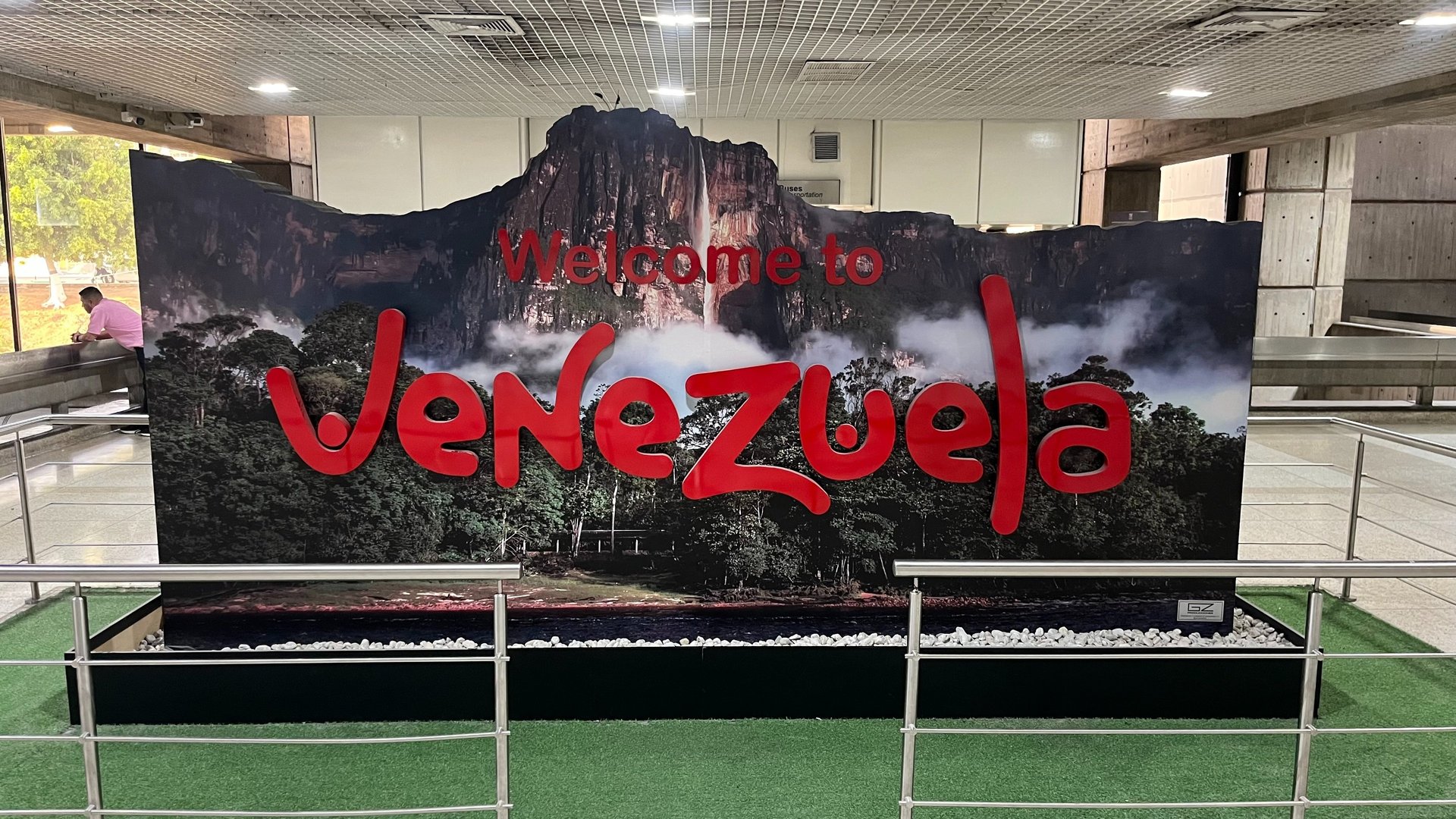 an abstract photo of a curved building with a blue sky in the background
