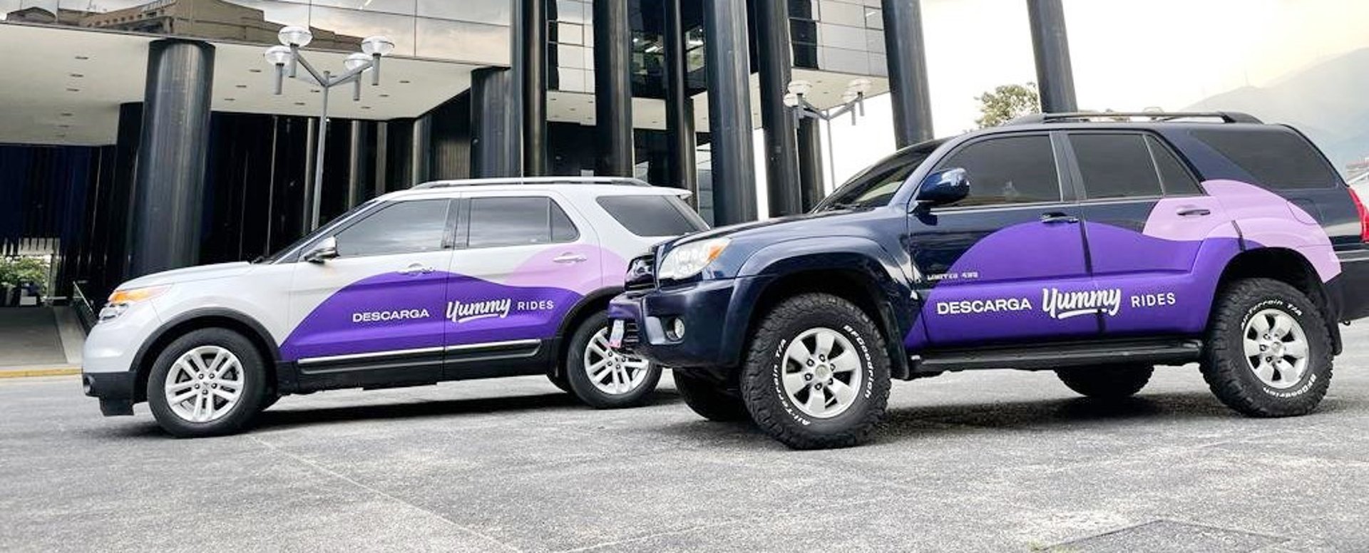 an abstract photo of a curved building with a blue sky in the background