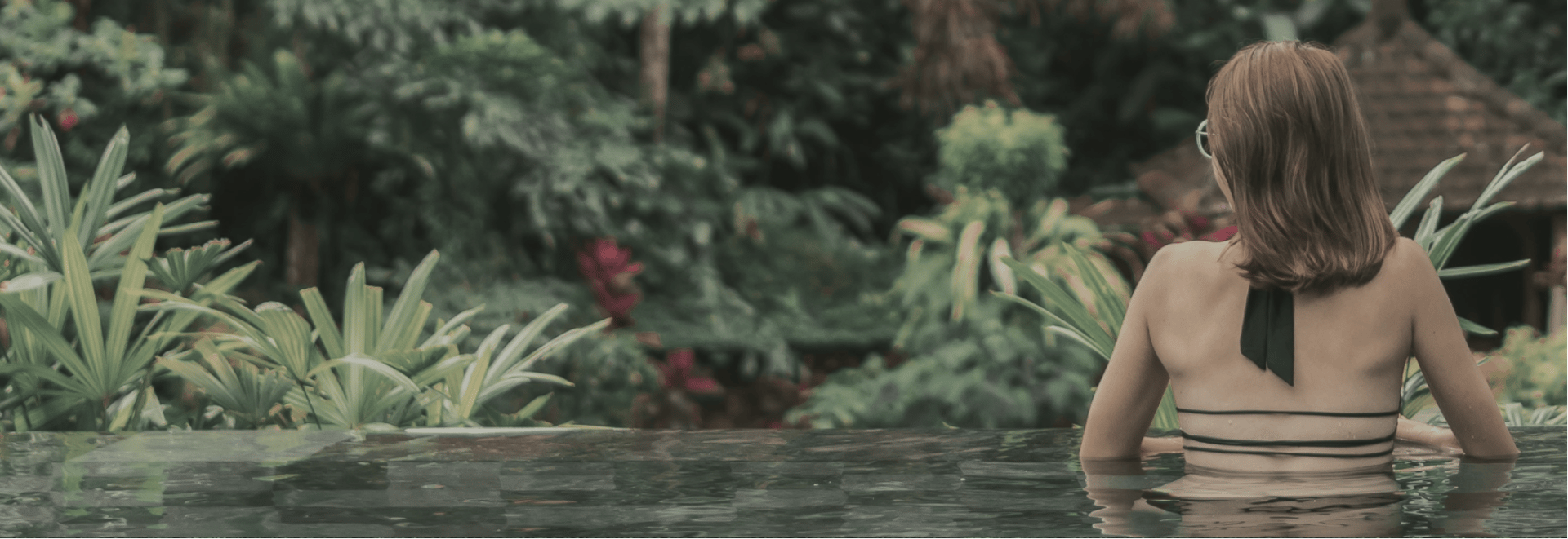Woman relaxing in Kerala eco resort.