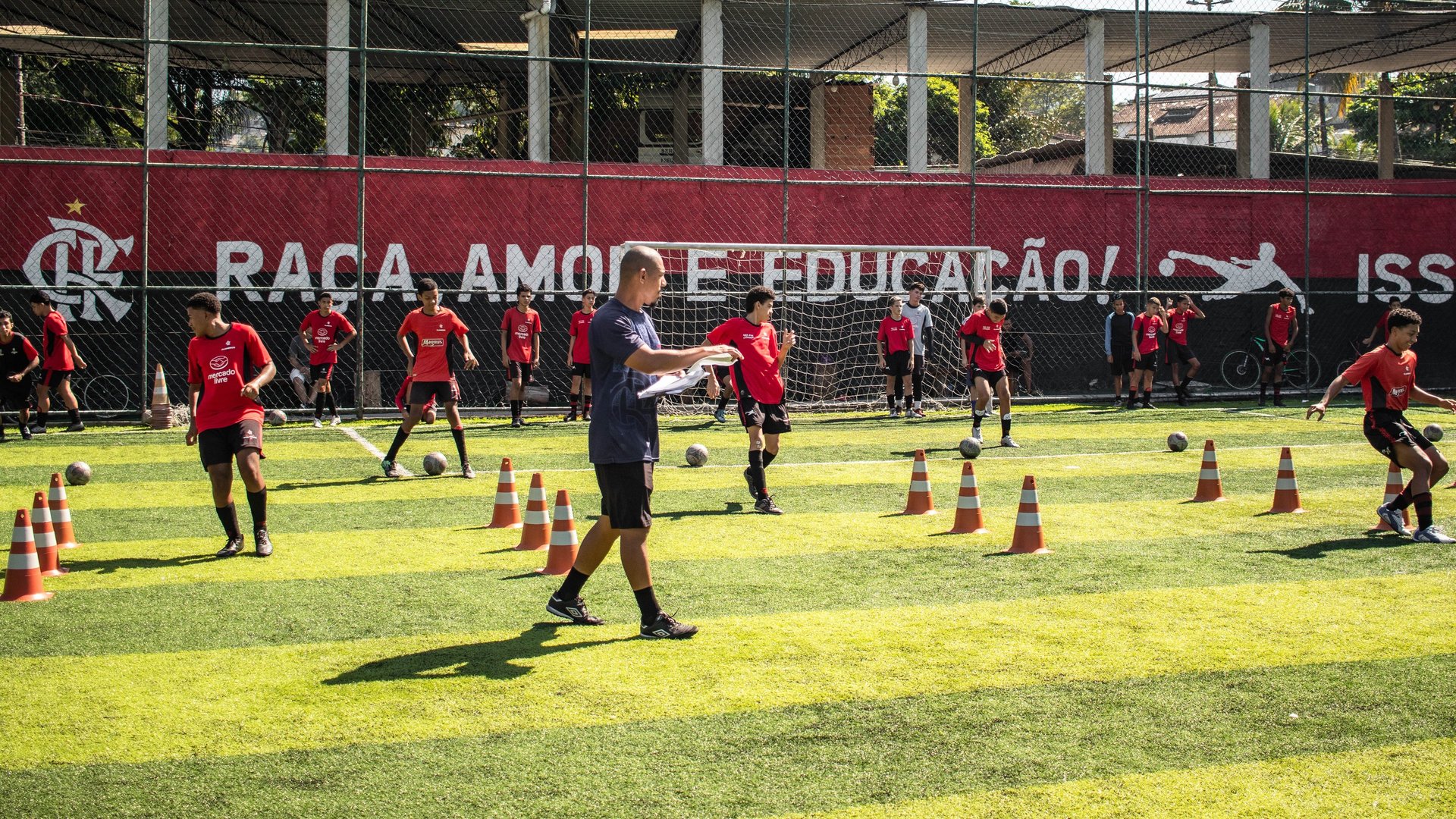 a red and black striped flag in a stadium