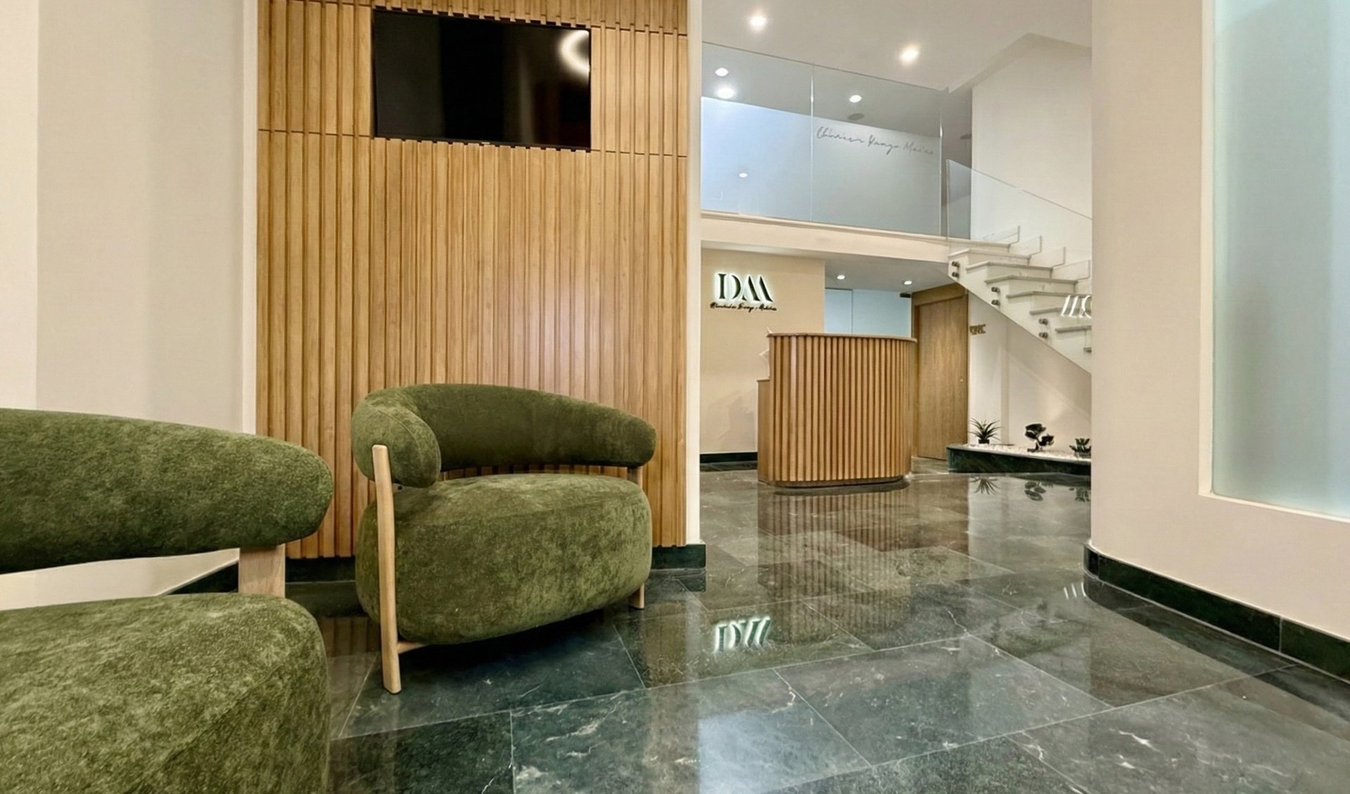 an abstract photo of a curved building with a blue sky in the background