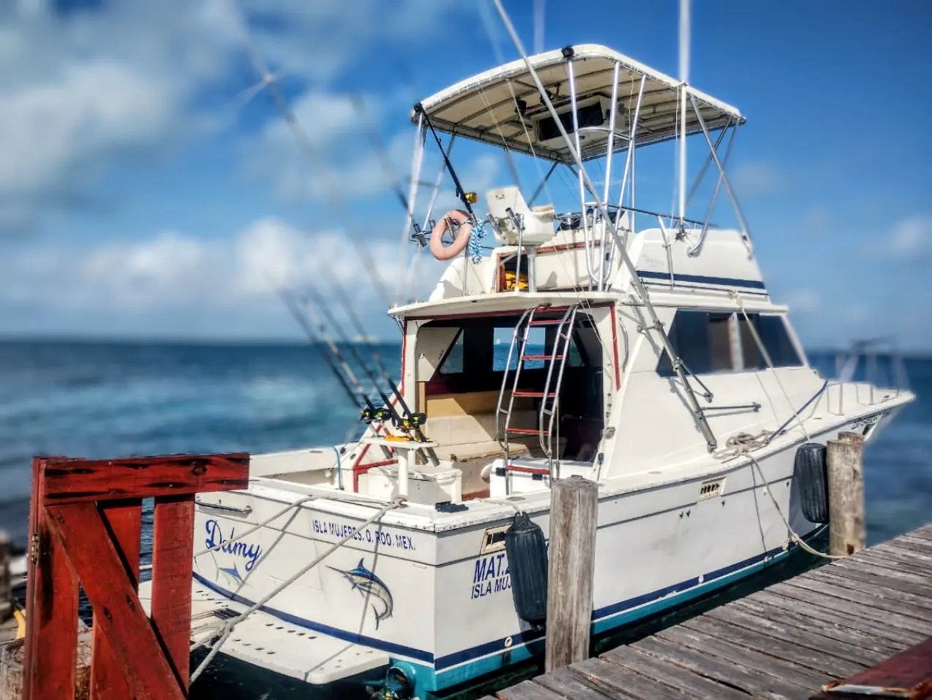 an abstract photo of a curved building with a blue sky in the background