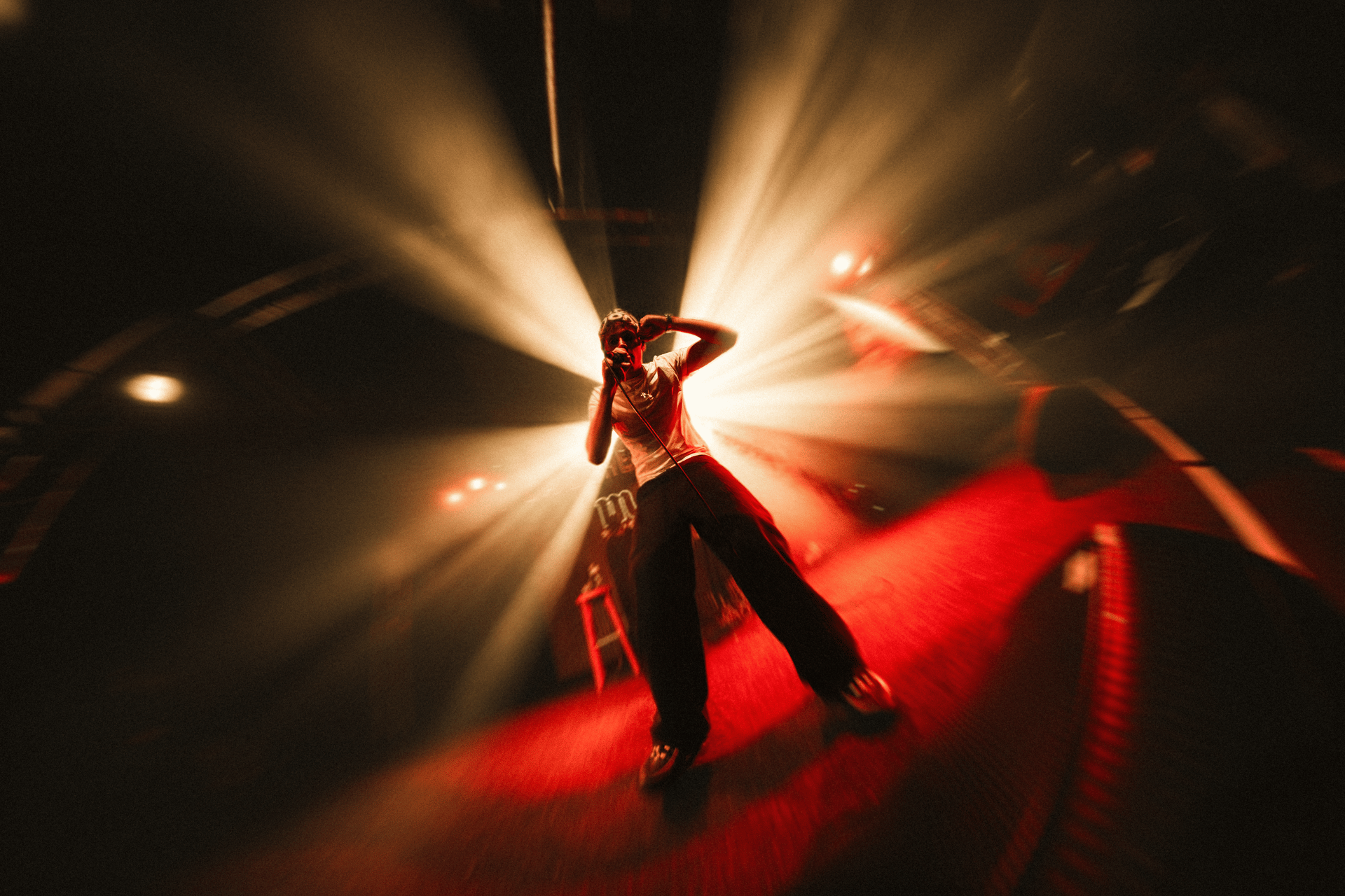 an abstract photo of a curved building with a blue sky in the background