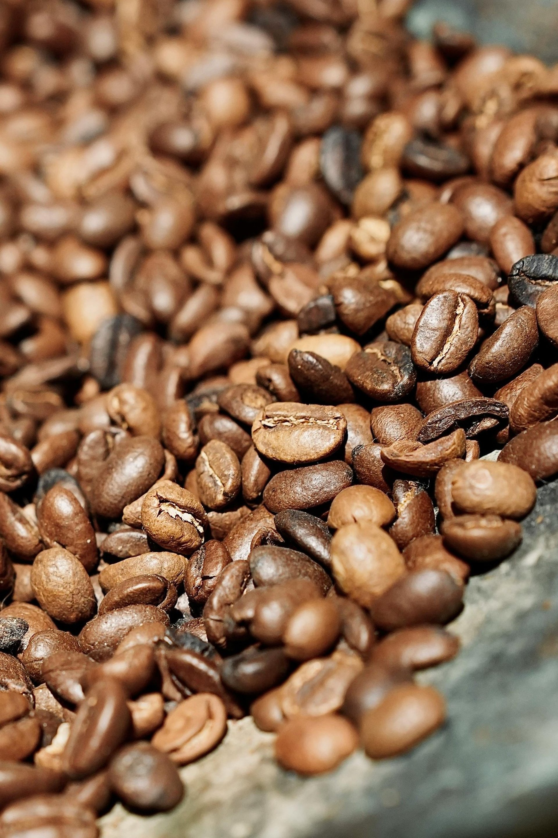 an abstract photo of a curved building with a blue sky in the background