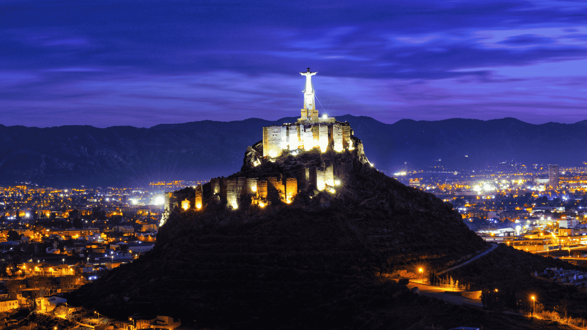 woman wearing yellow long-sleeved dress under white clouds and blue sky during daytime