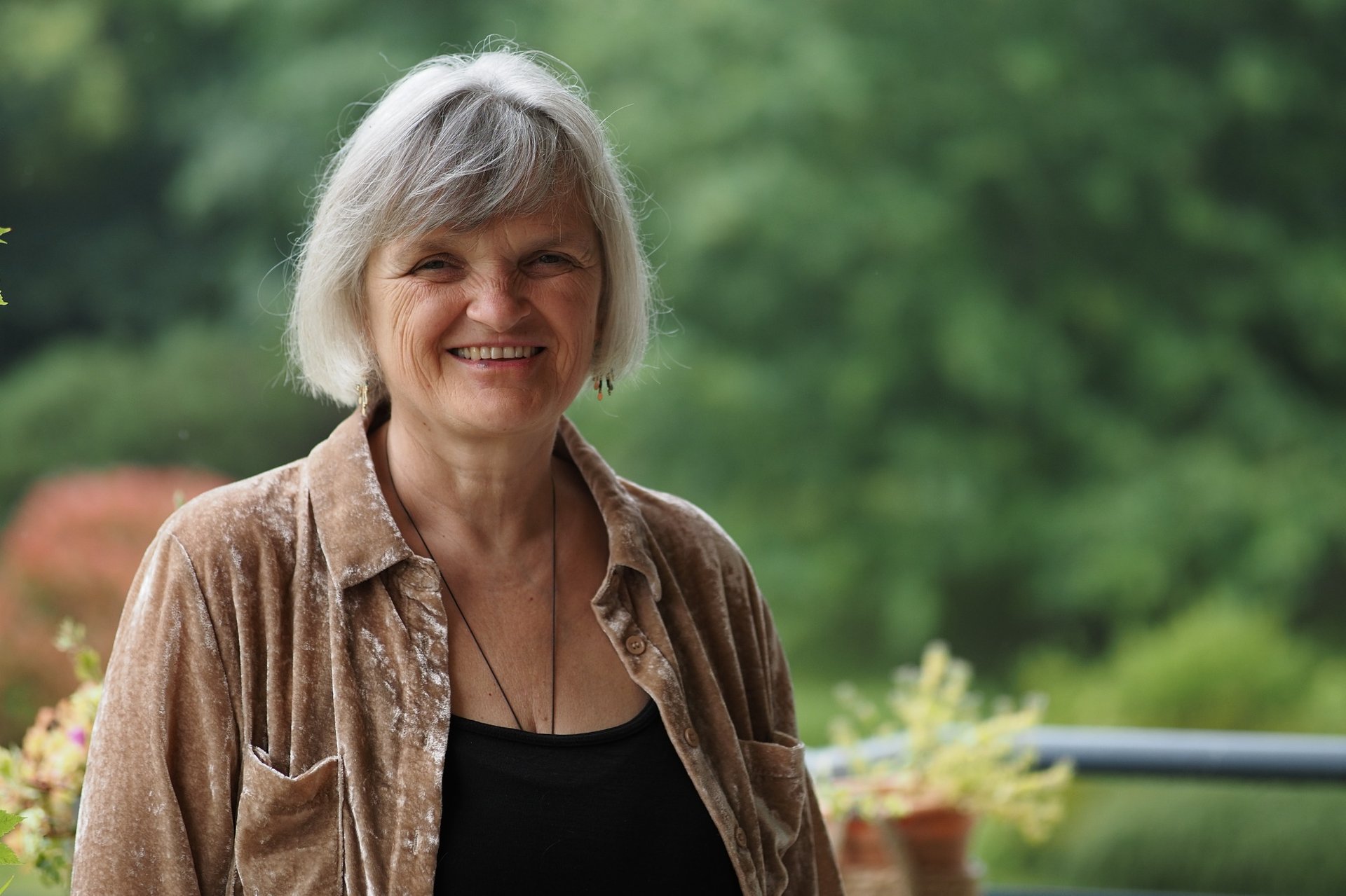 woman in black blazer sitting on chair