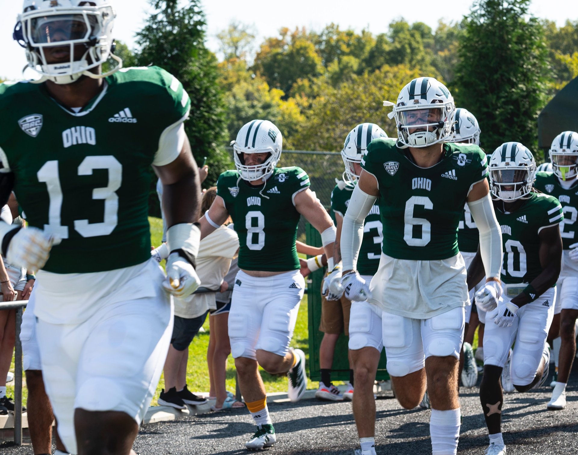 an abstract photo of a curved building with a blue sky in the background