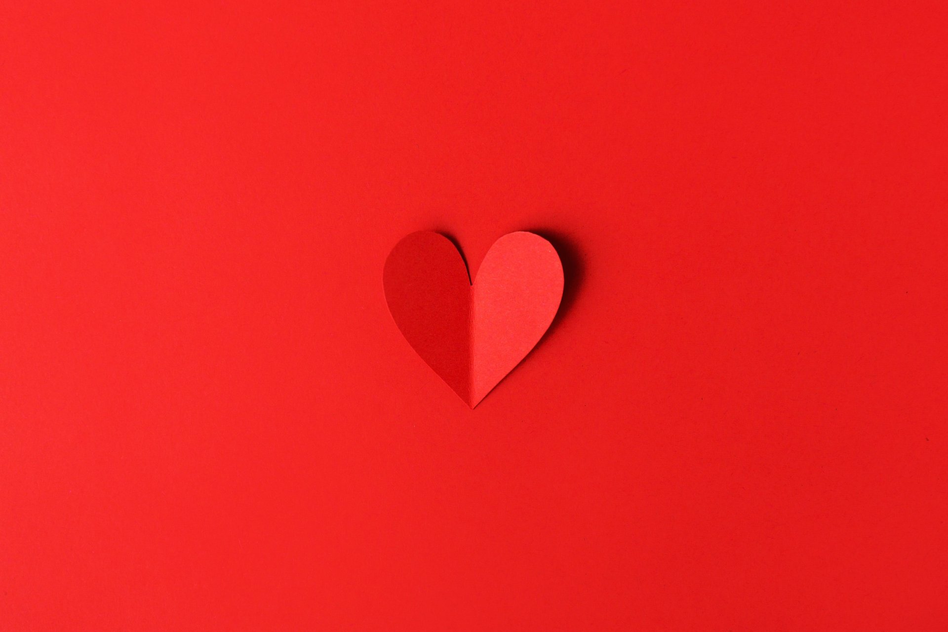 pink heart shaped balloon on white textile