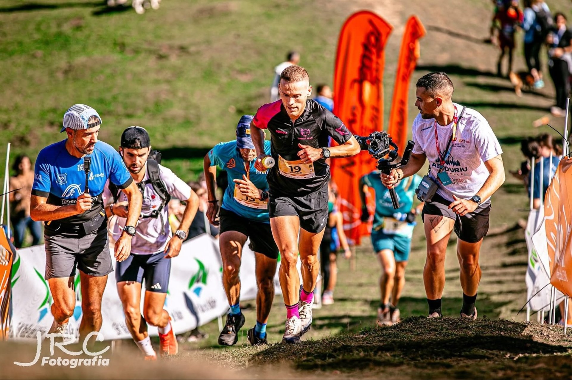 an abstract photo of a curved building with a blue sky in the background