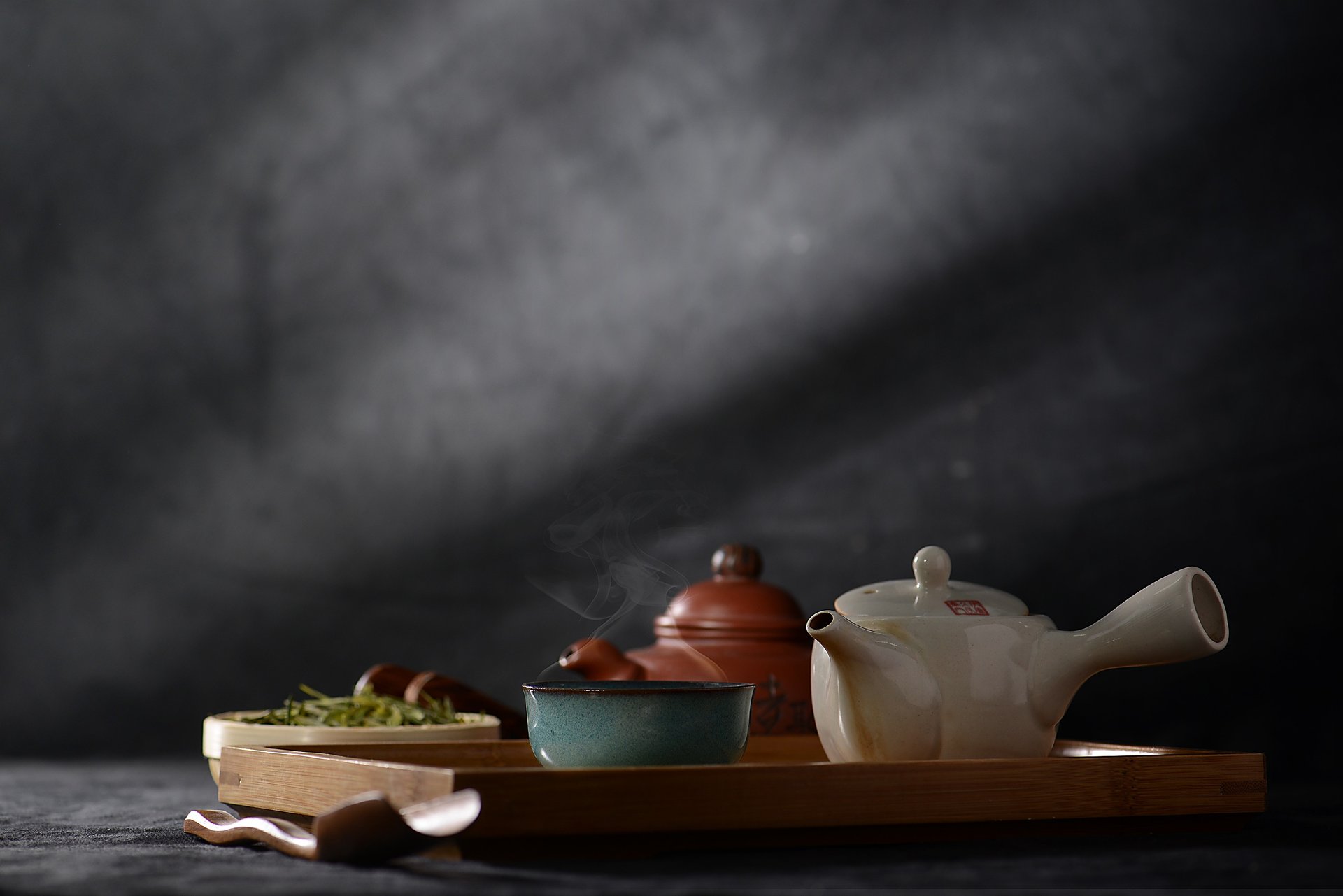 black ceramic teapot with cups