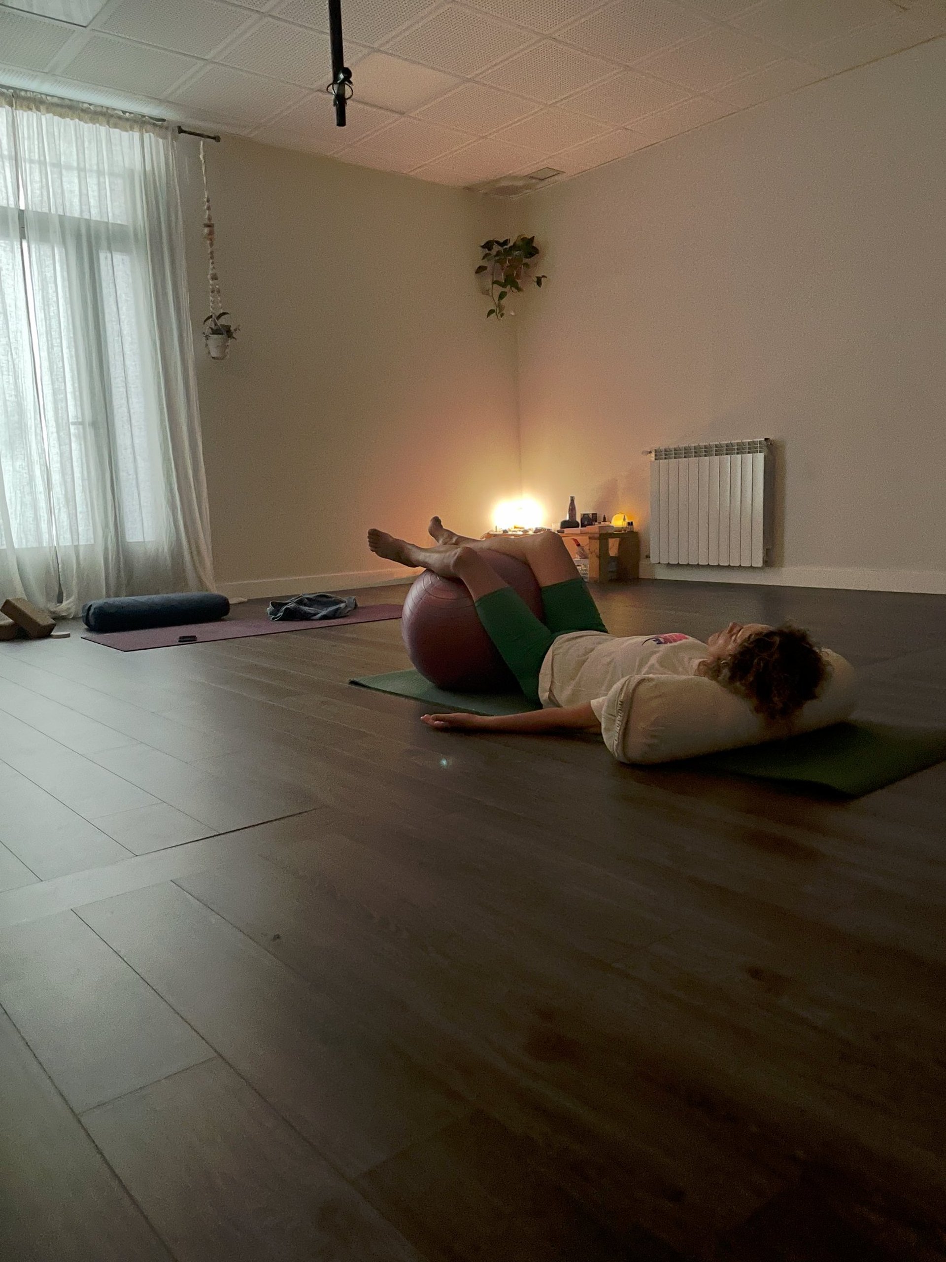 an abstract photo of a curved building with a blue sky in the background