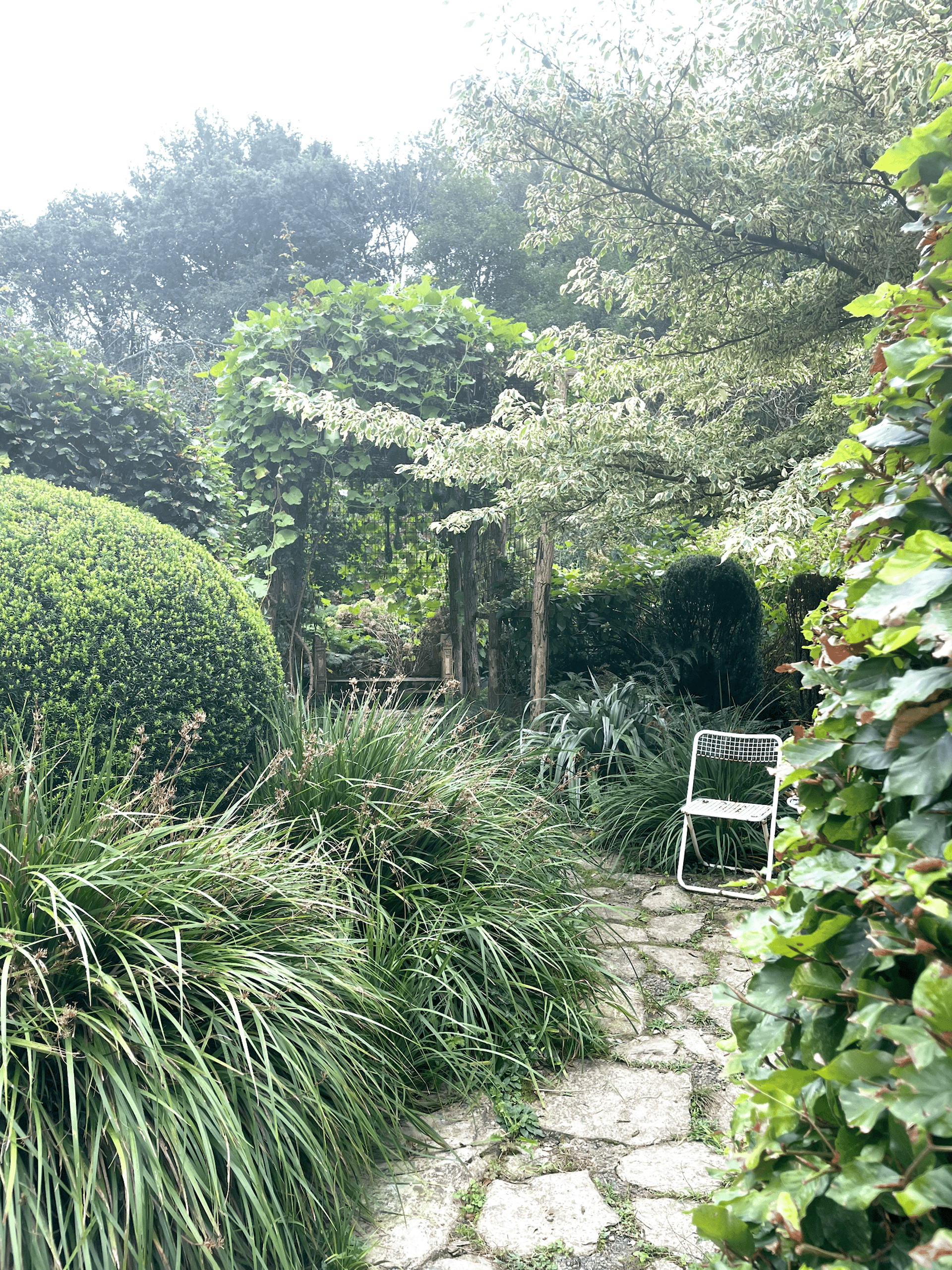 an abstract photo of a curved building with a blue sky in the background