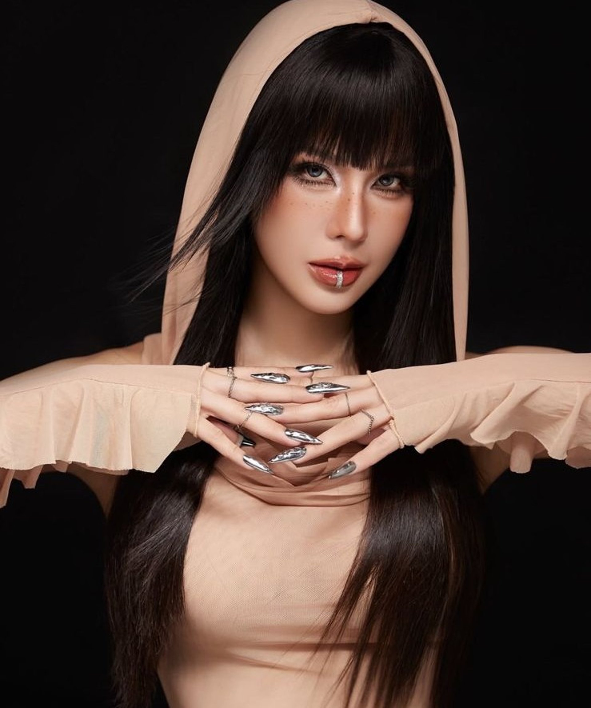 woman wearing yellow long-sleeved dress under white clouds and blue sky during daytime