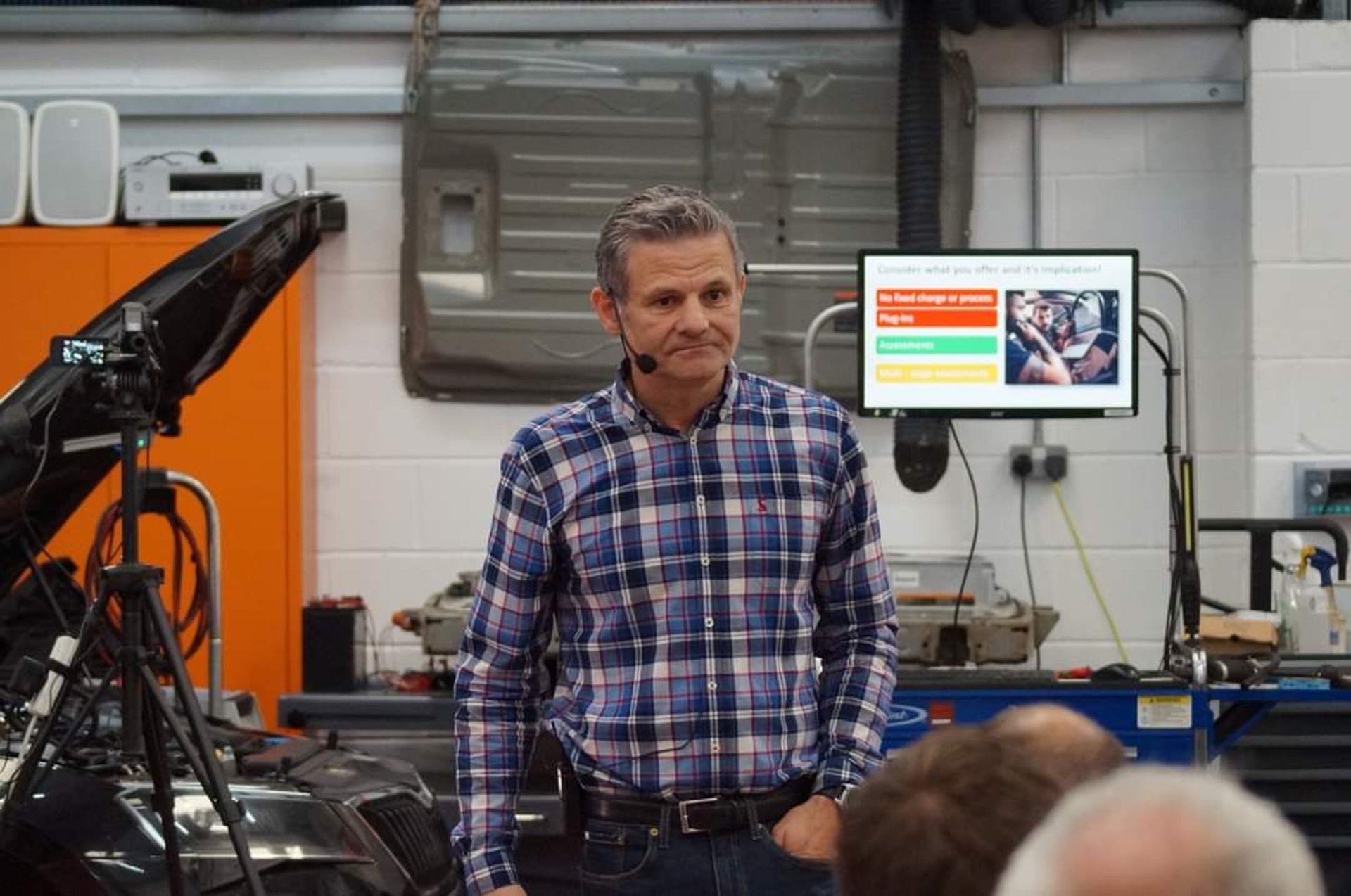 a pair of silver cufflinks on a black background