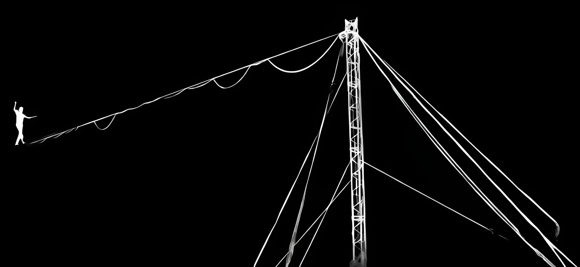 an abstract photo of a curved building with a blue sky in the background