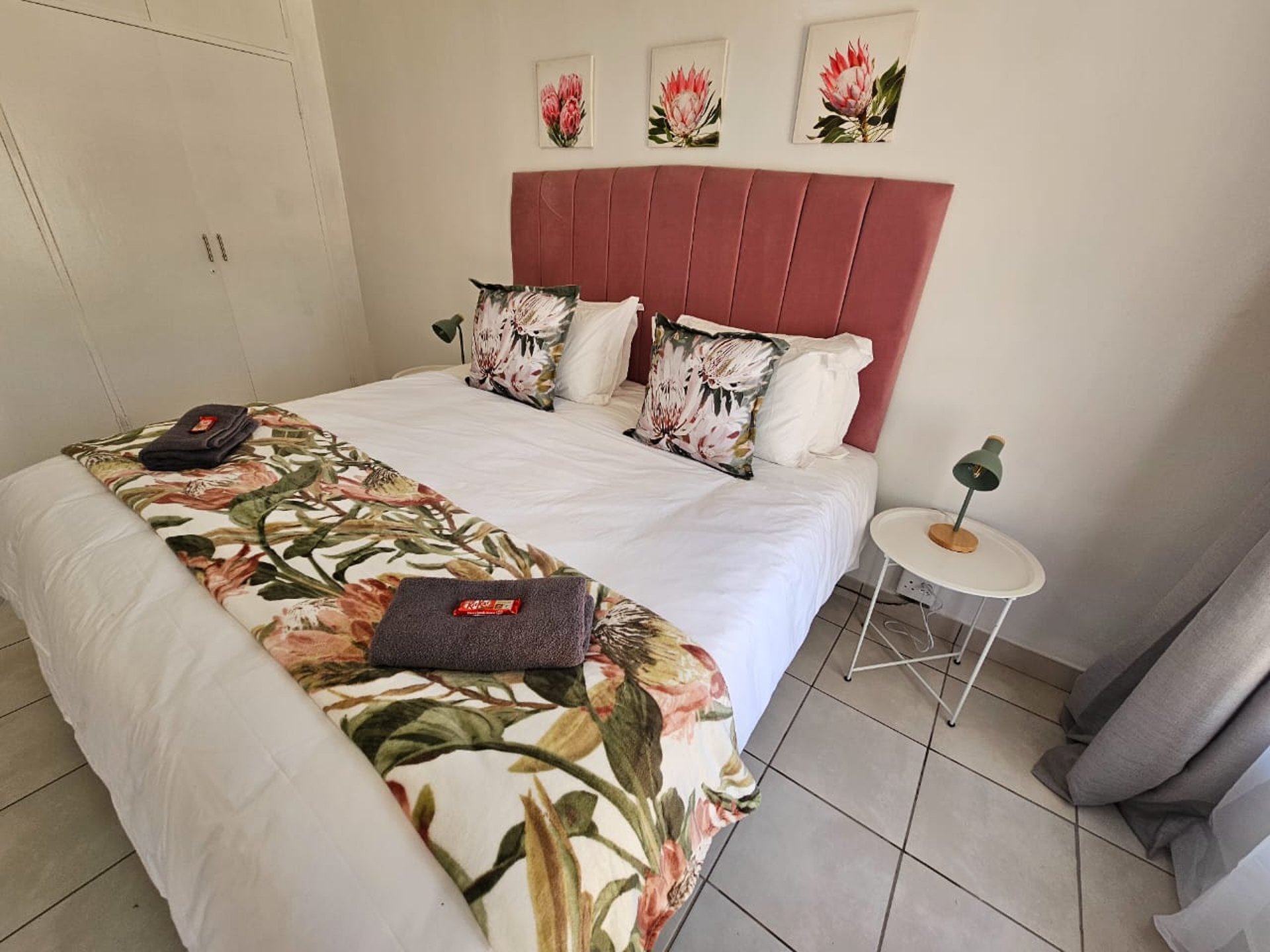 a bedroom with a large bed and a large window