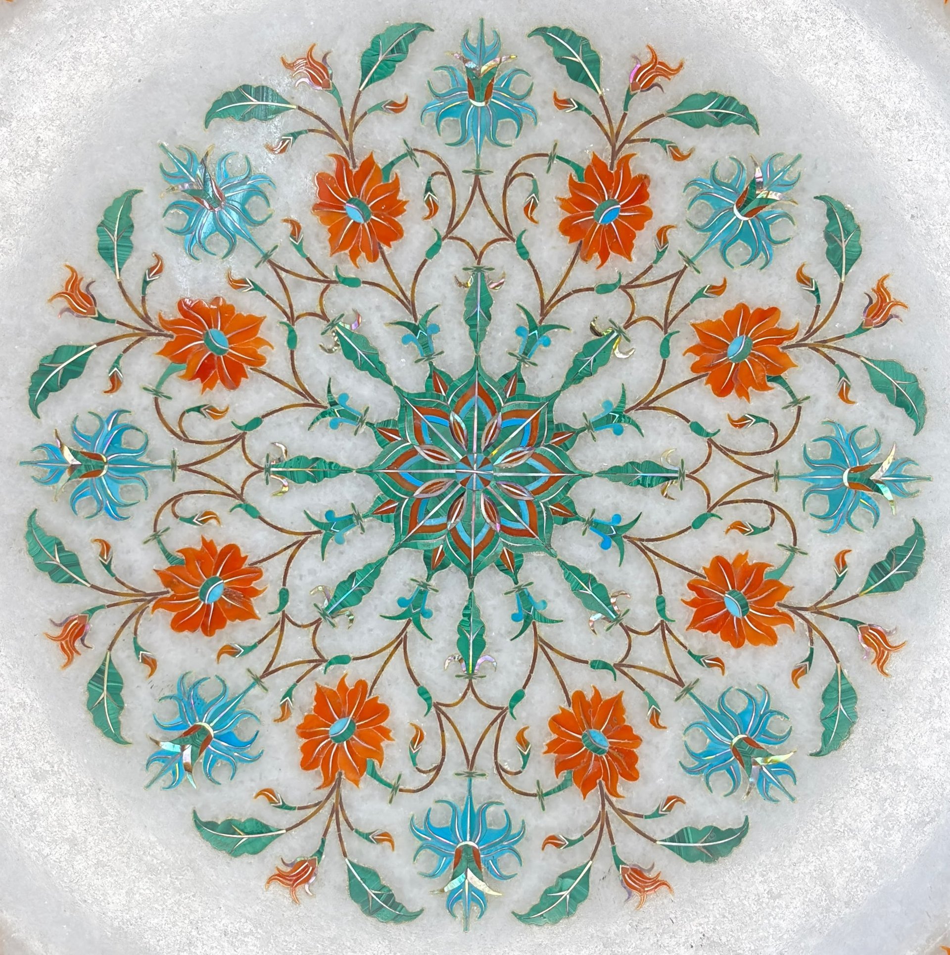 an abstract photo of a curved building with a blue sky in the background