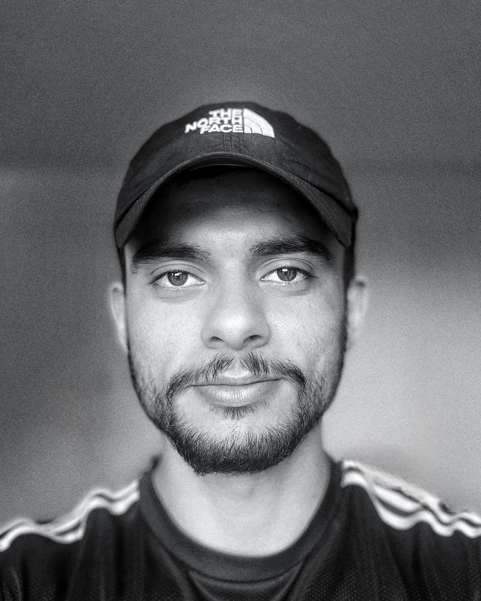 a black and white photo of a white wall