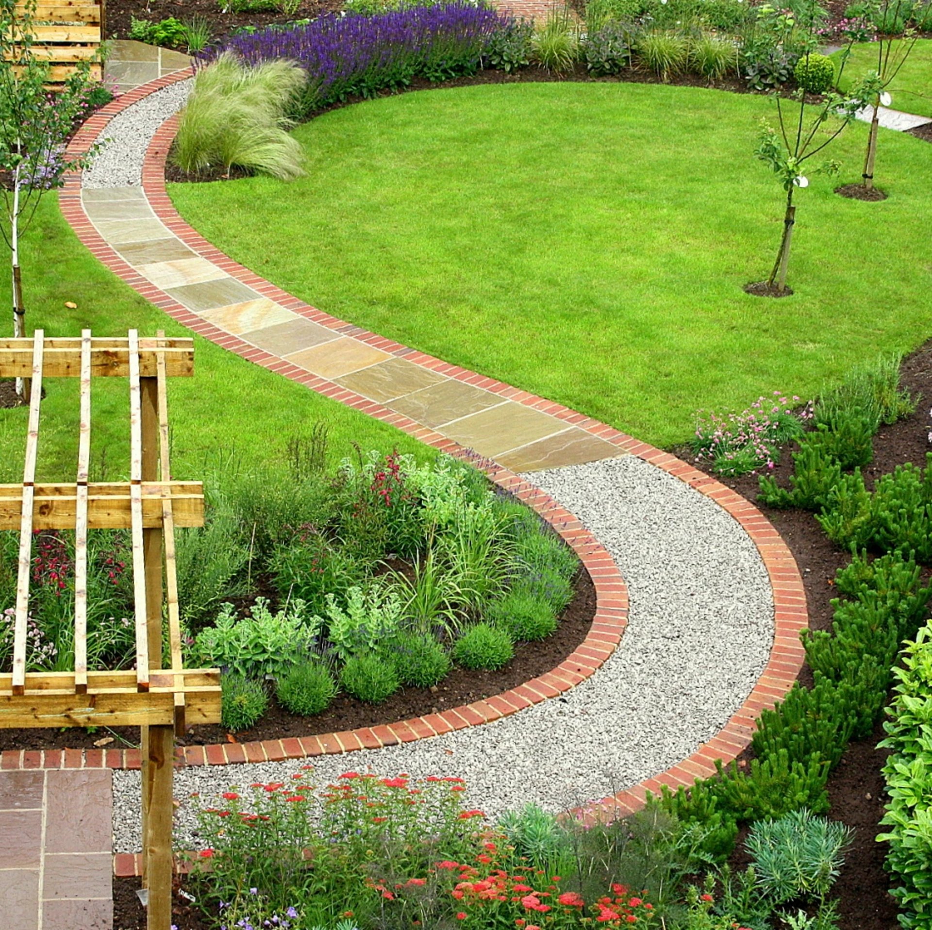 an abstract photo of a curved building with a blue sky in the background