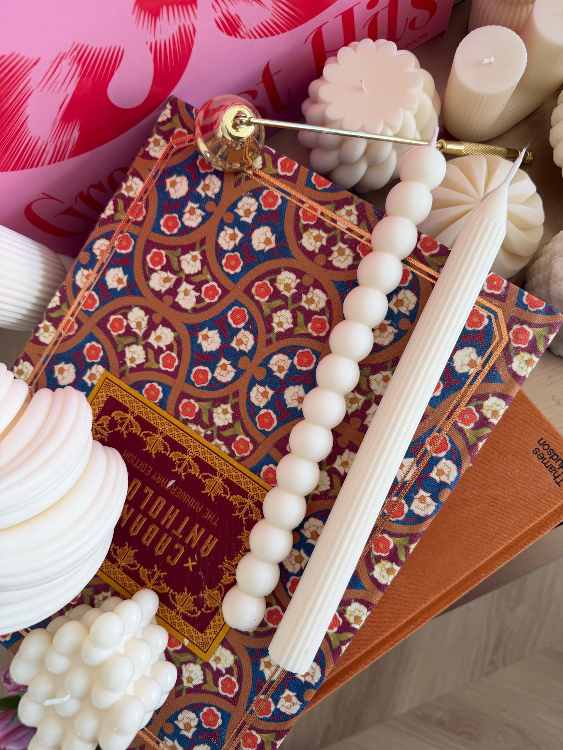 white pillar candle on brown round cake