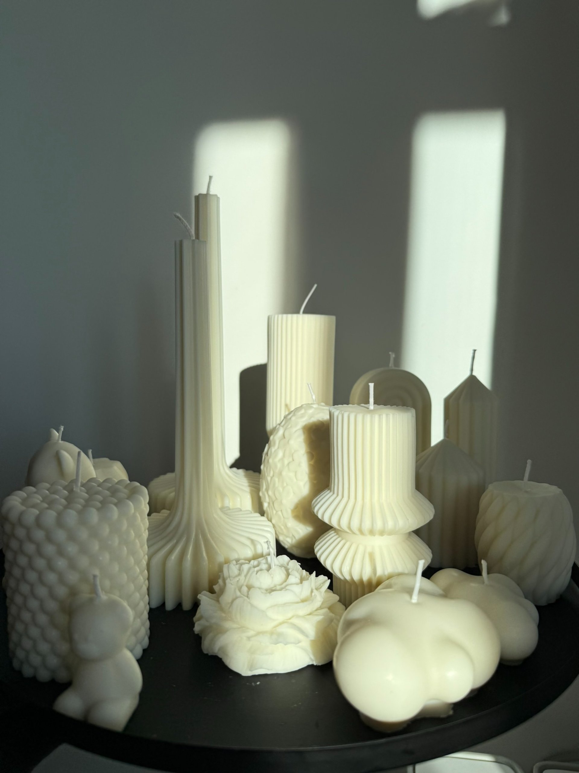 white pillar candle on brown round cake