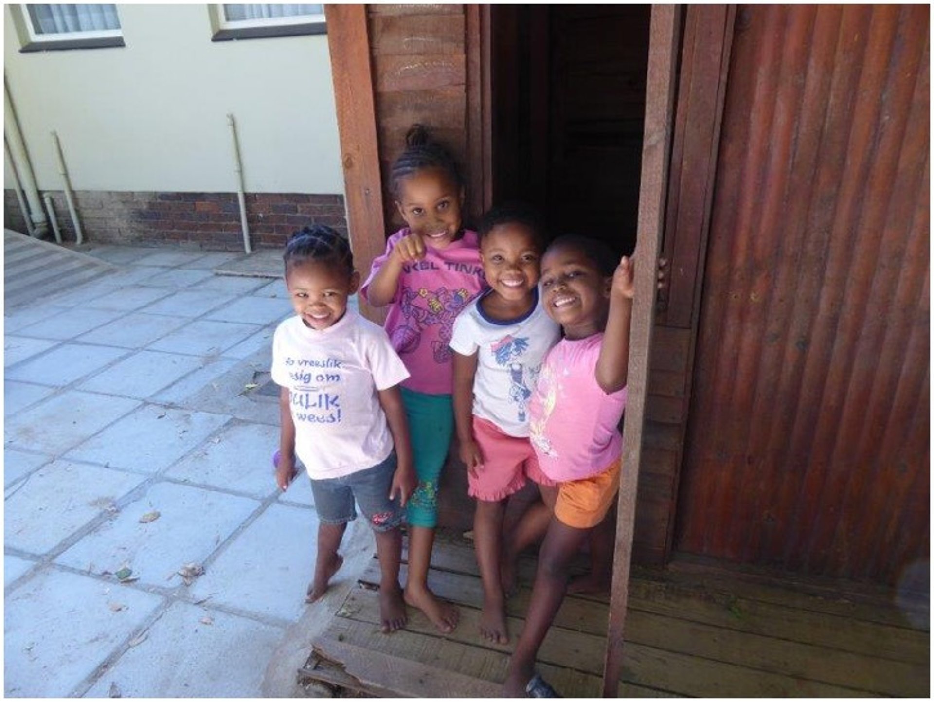 woman reading book while sitting on chair