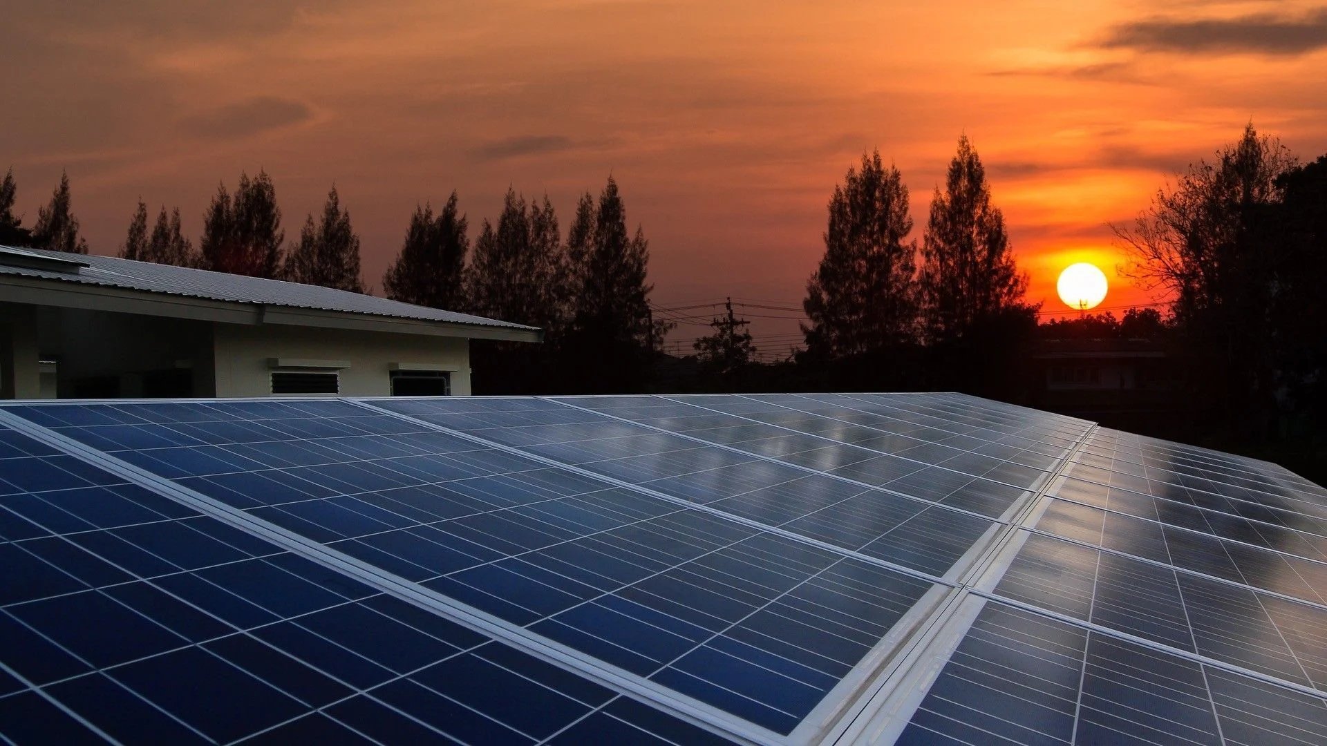 a white hard hat sitting on top of a solar panel