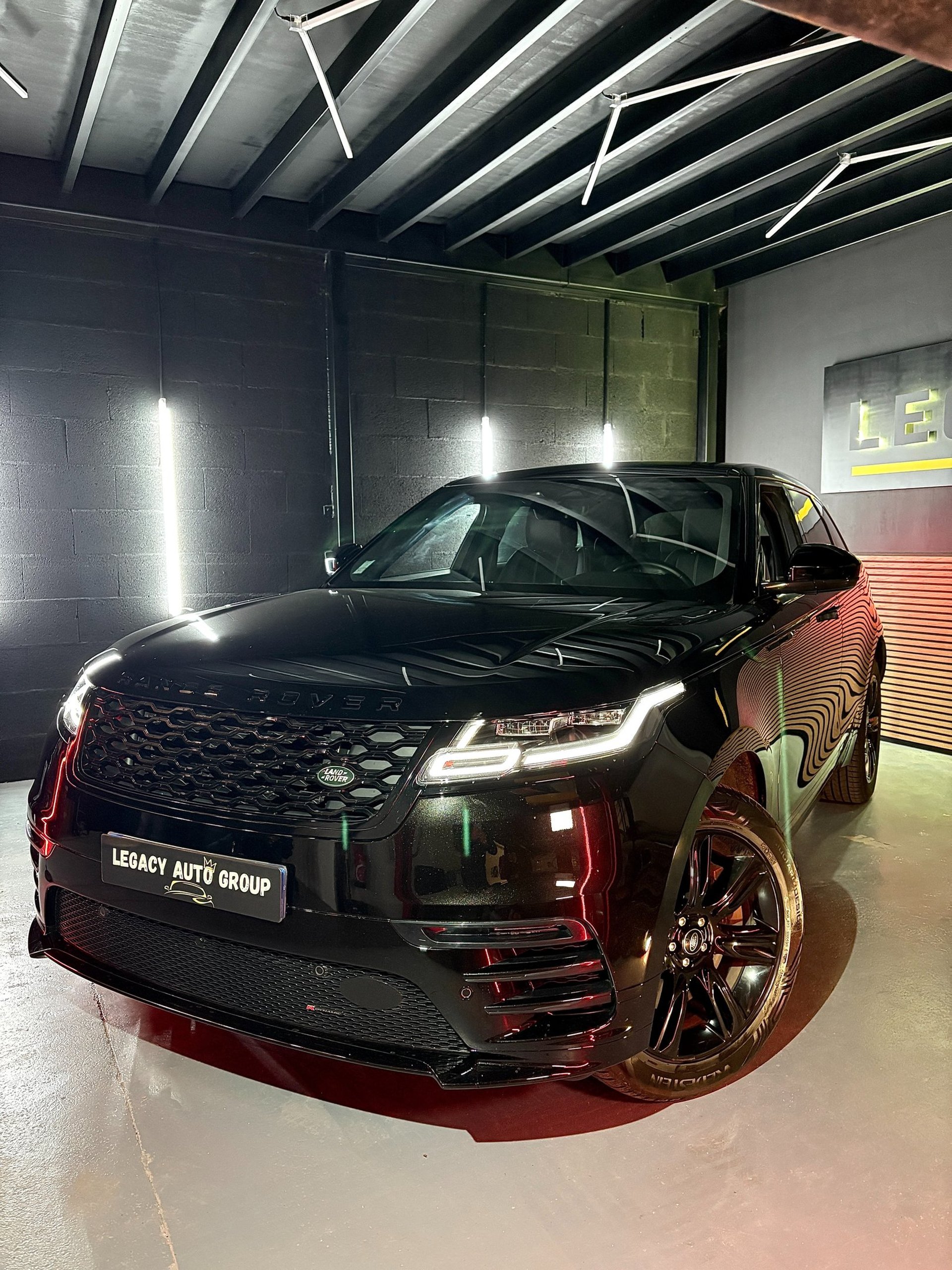 a grey mini cooper parked on the side of the road