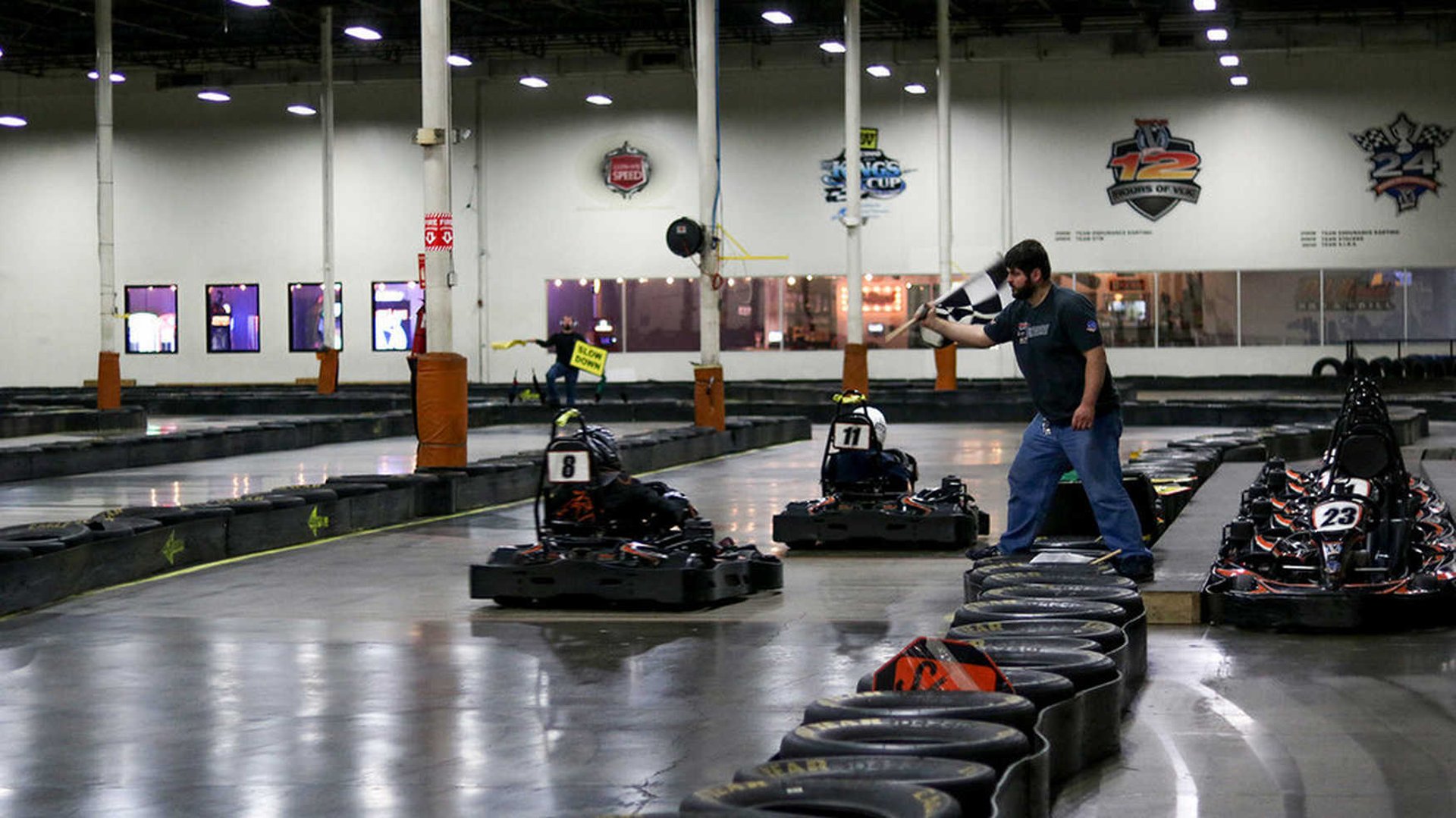a person riding a go kart in a building