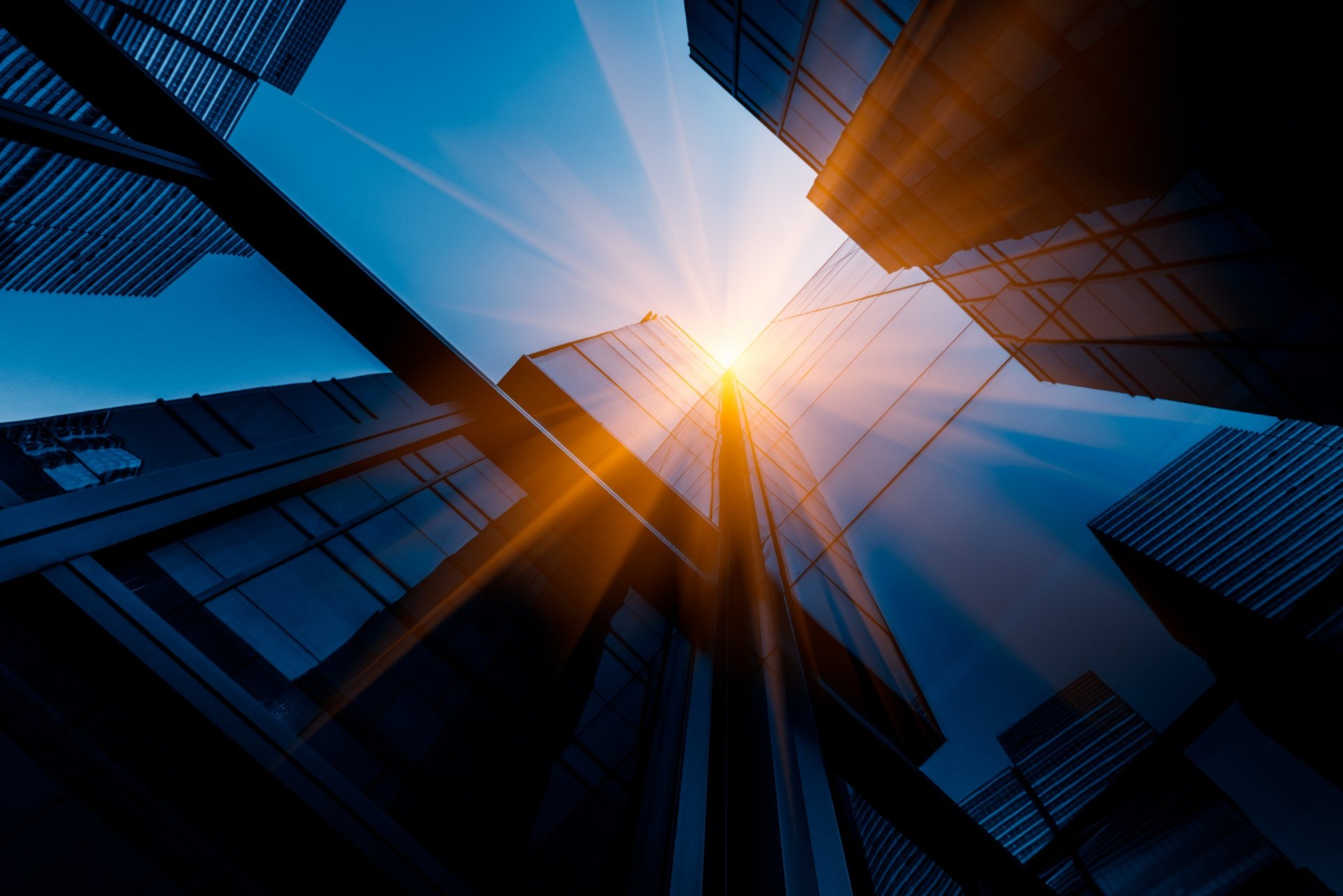 an abstract photo of a curved building with a blue sky in the background