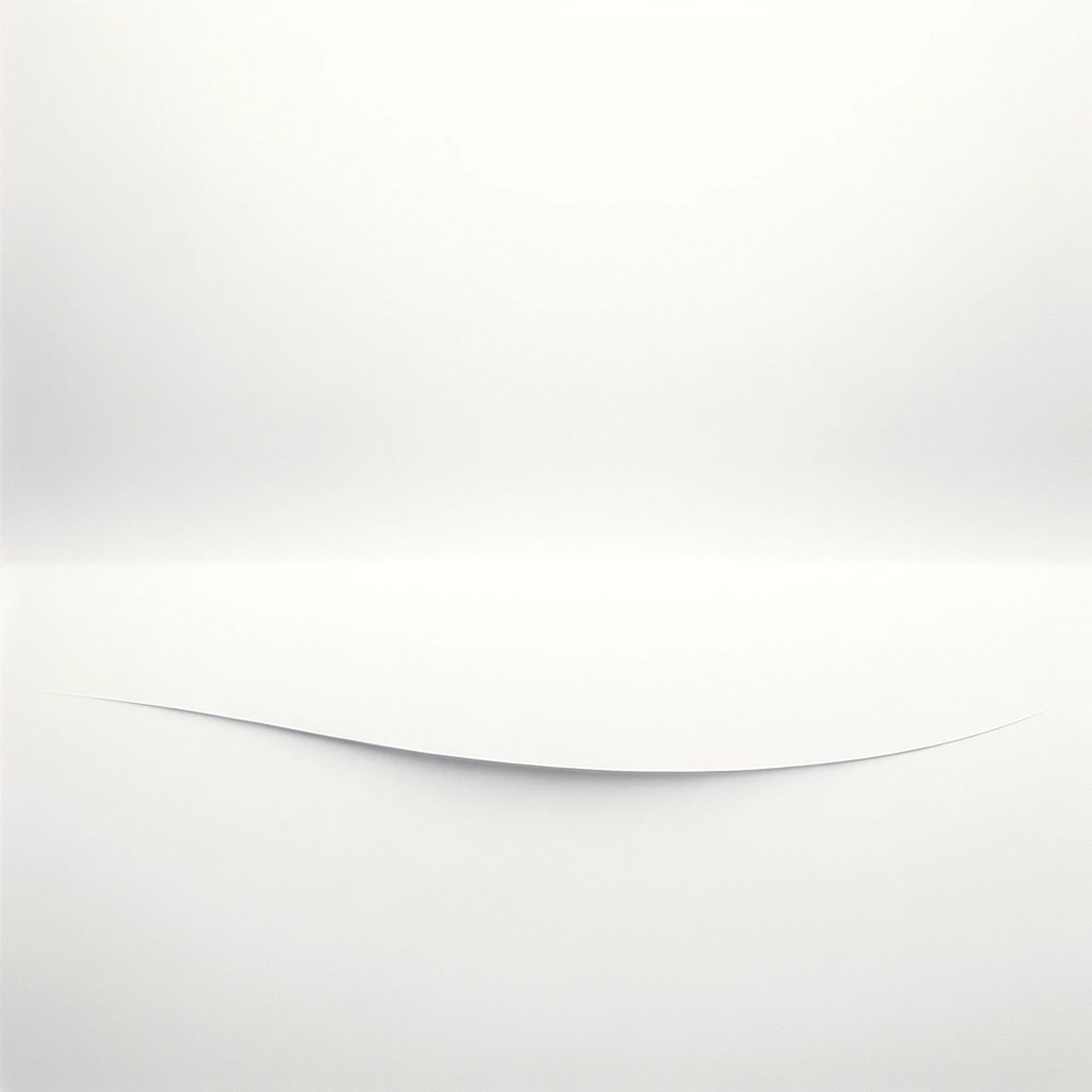 a black and white photo of a white wall