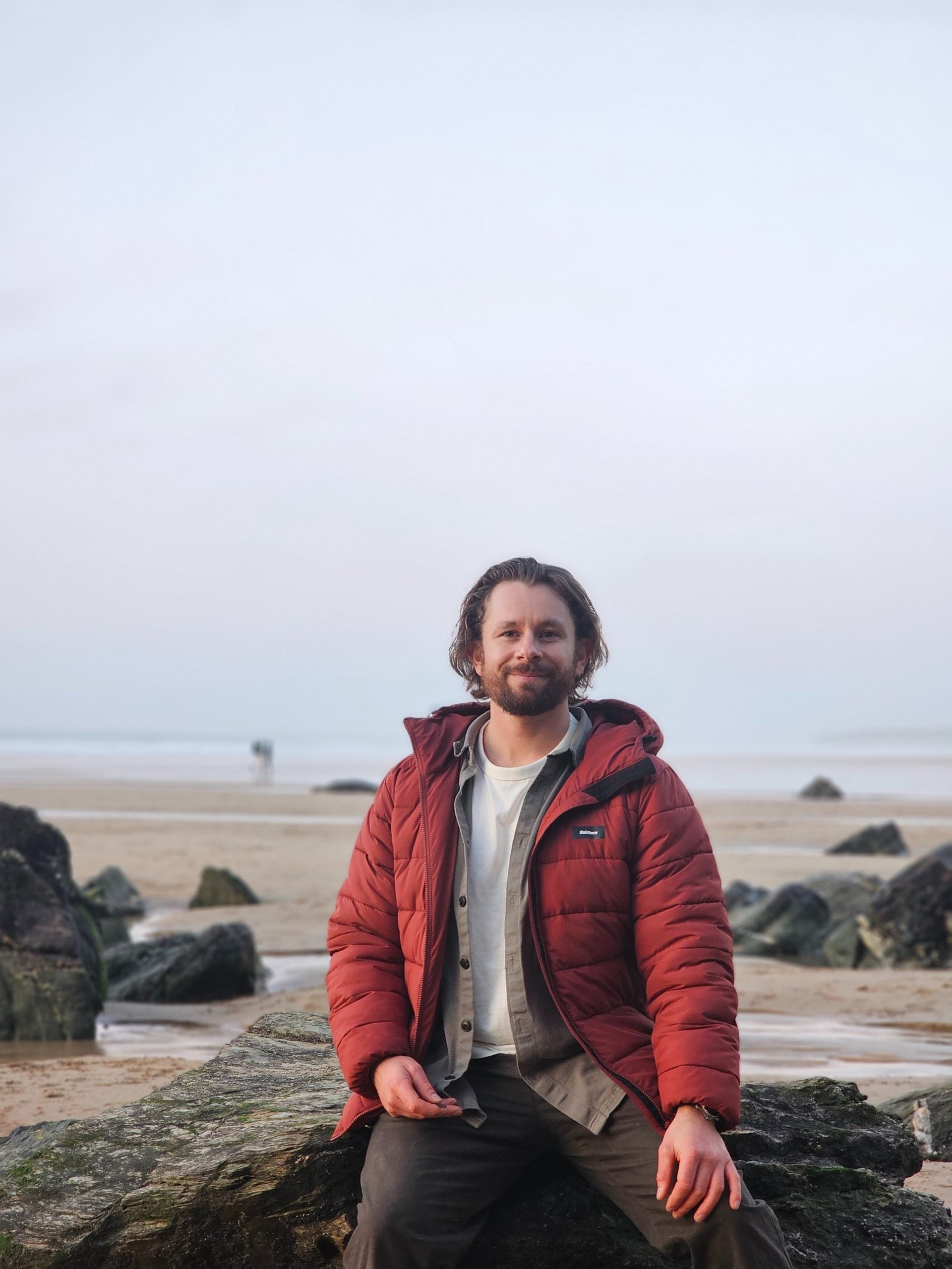 an abstract photo of a curved building with a blue sky in the background