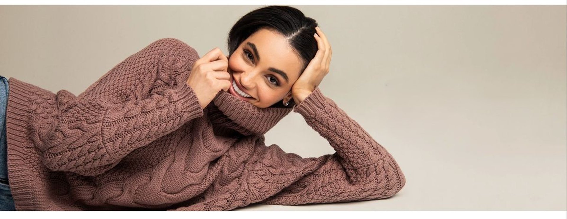 person wearing grey knit sweater