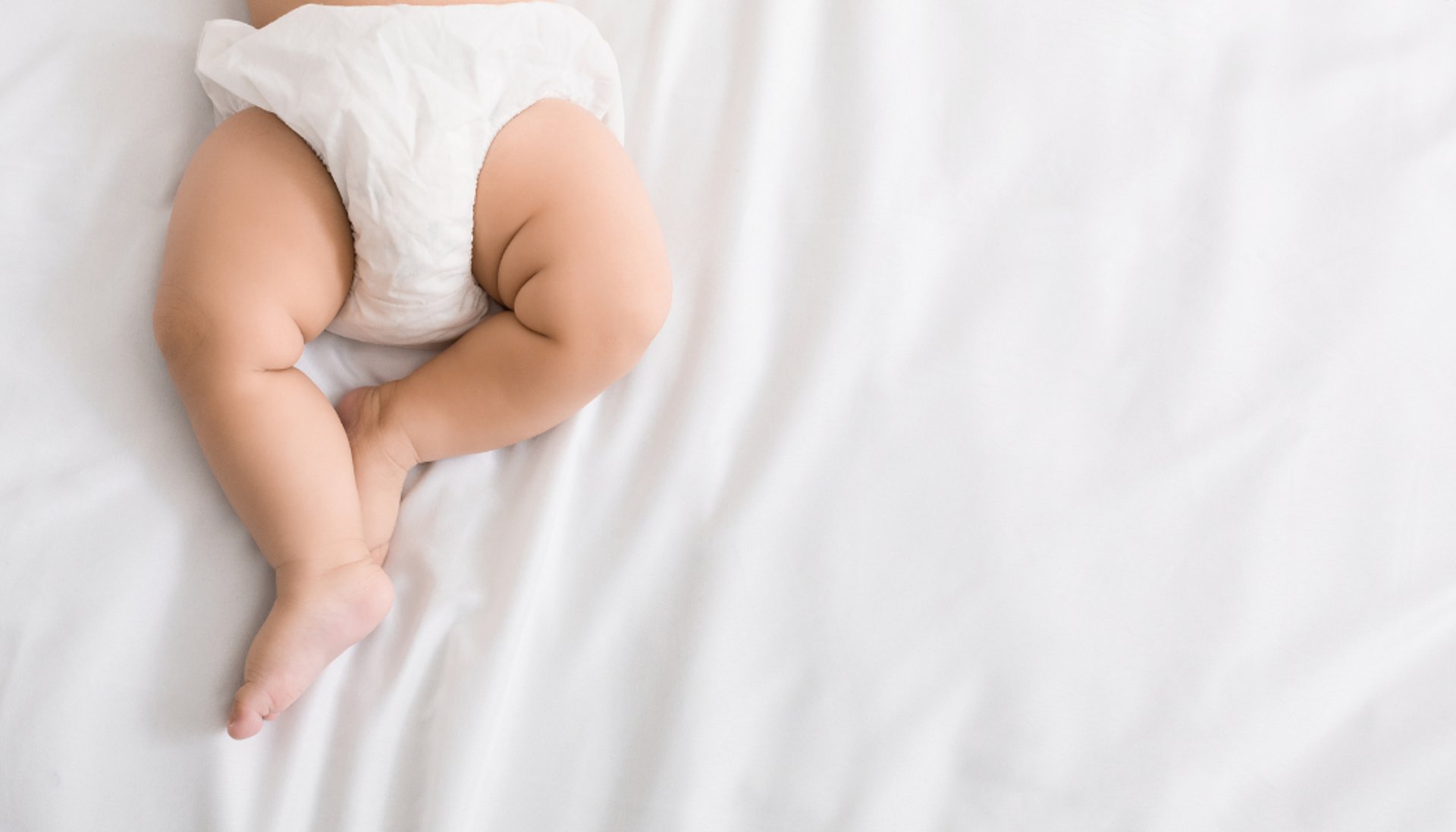 a pair of white socks sitting on top of a green and yellow table