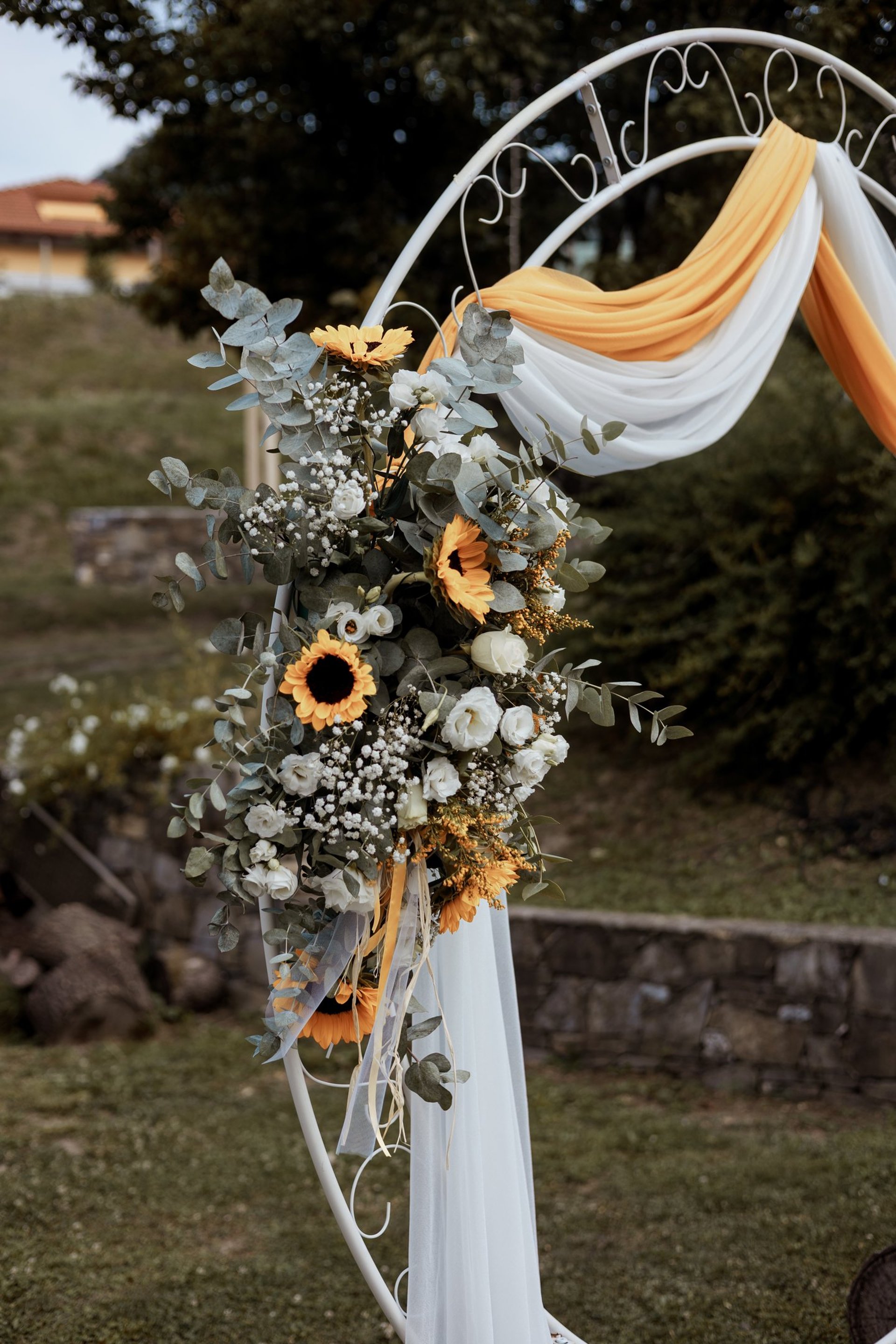 man and woman in wedding dress walking on brown grass field during daytime
