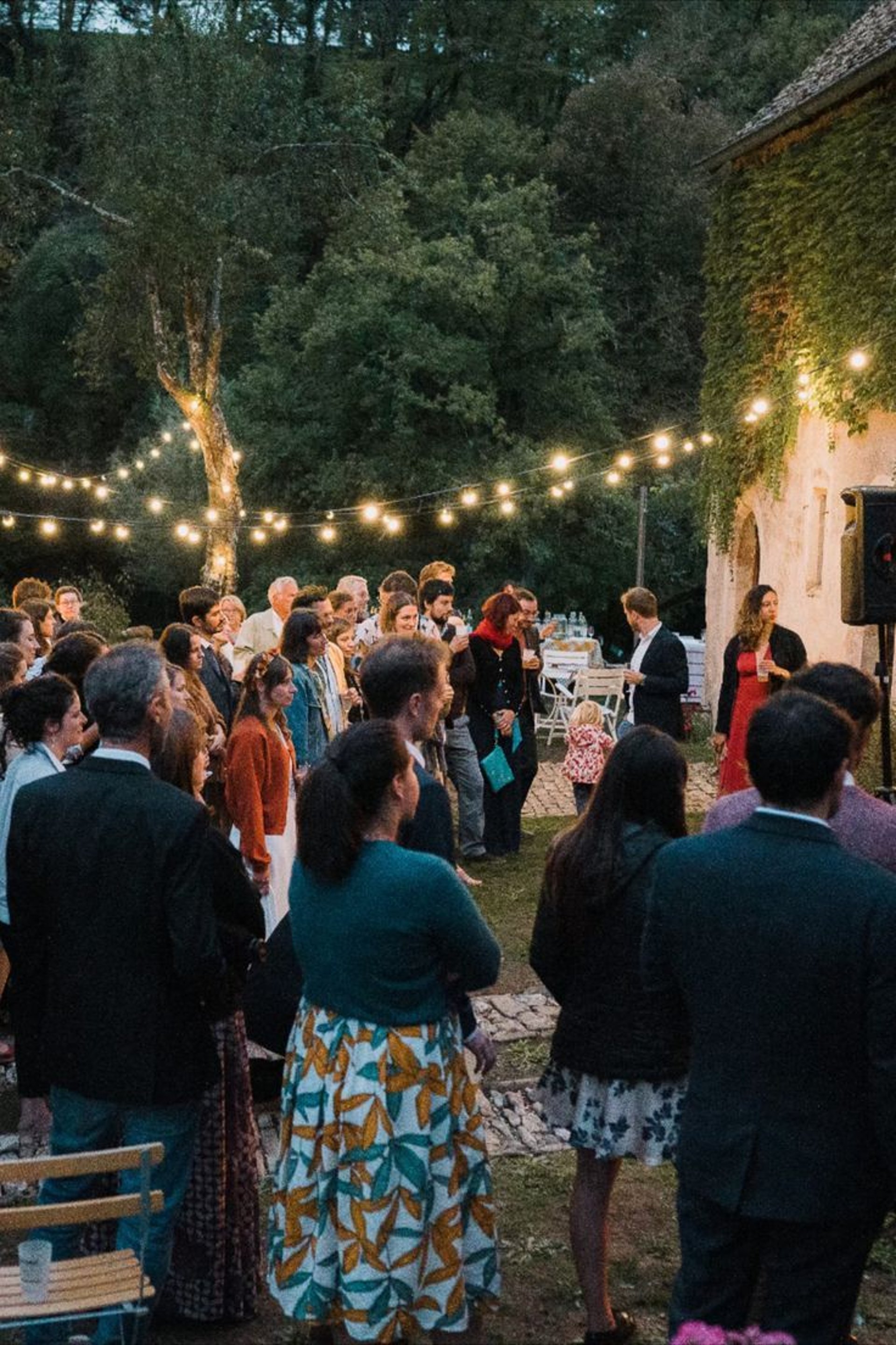 an abstract photo of a curved building with a blue sky in the background