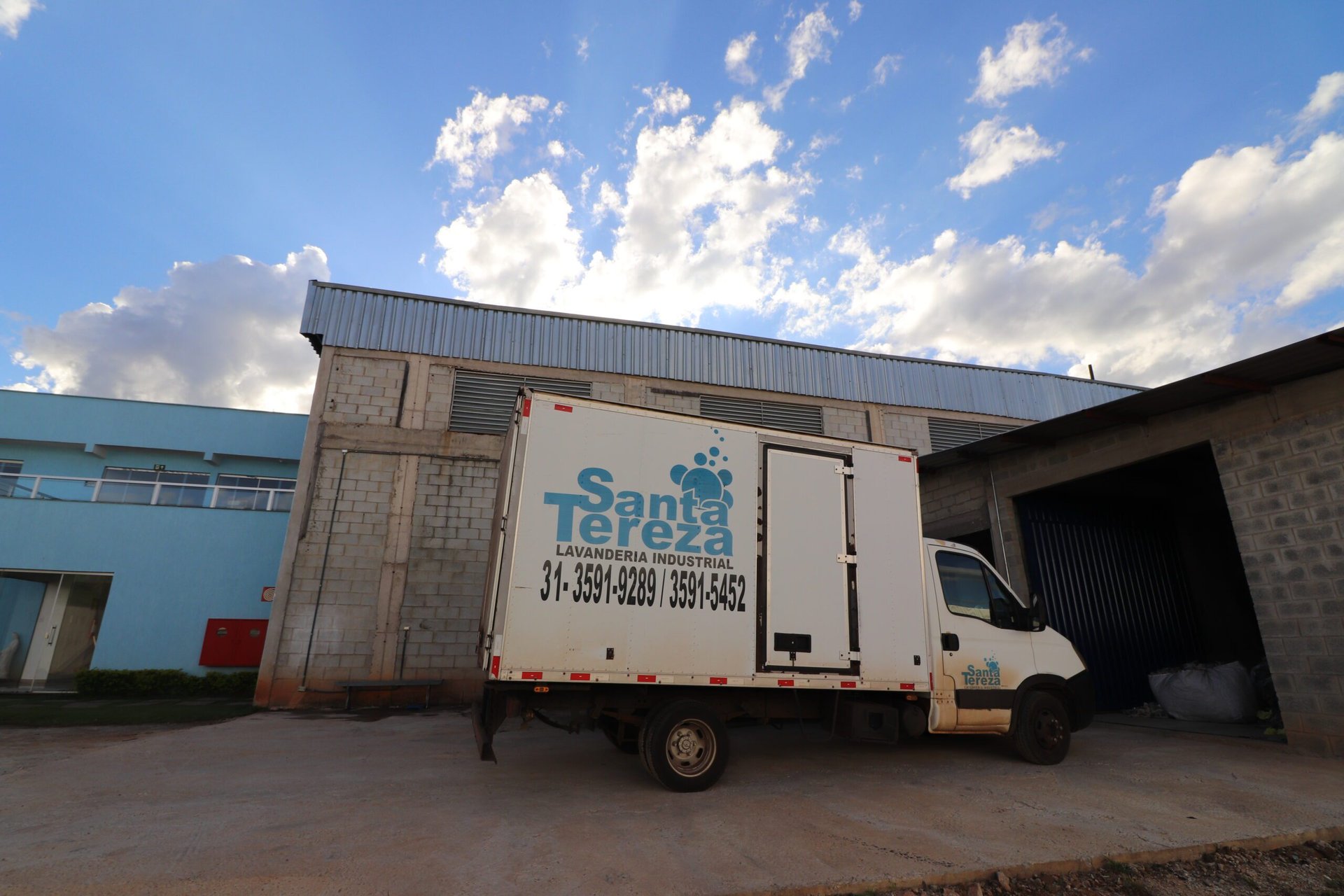 an abstract photo of a curved building with a blue sky in the background