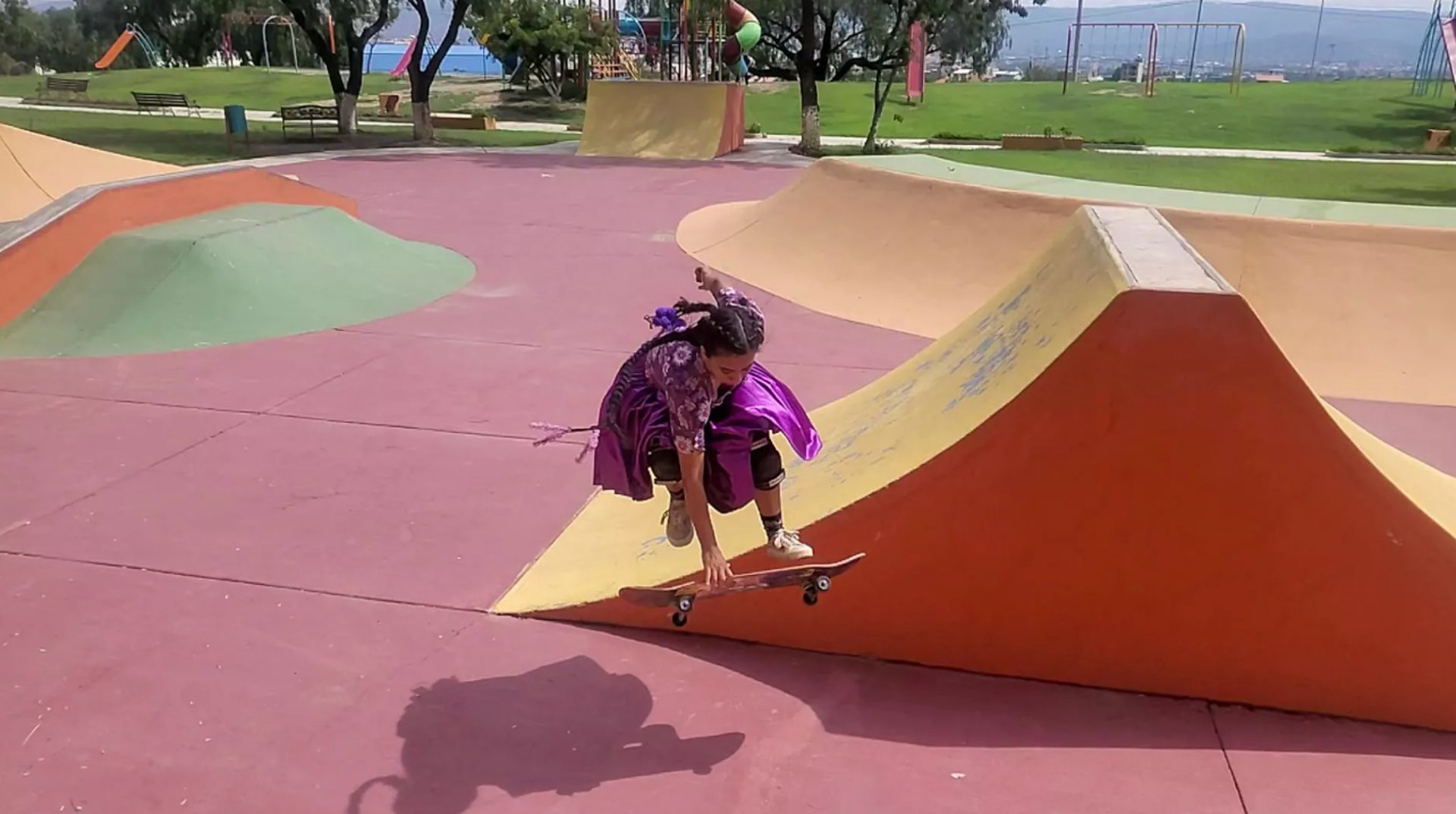 a boat floating on top of a lake surrounded by forest