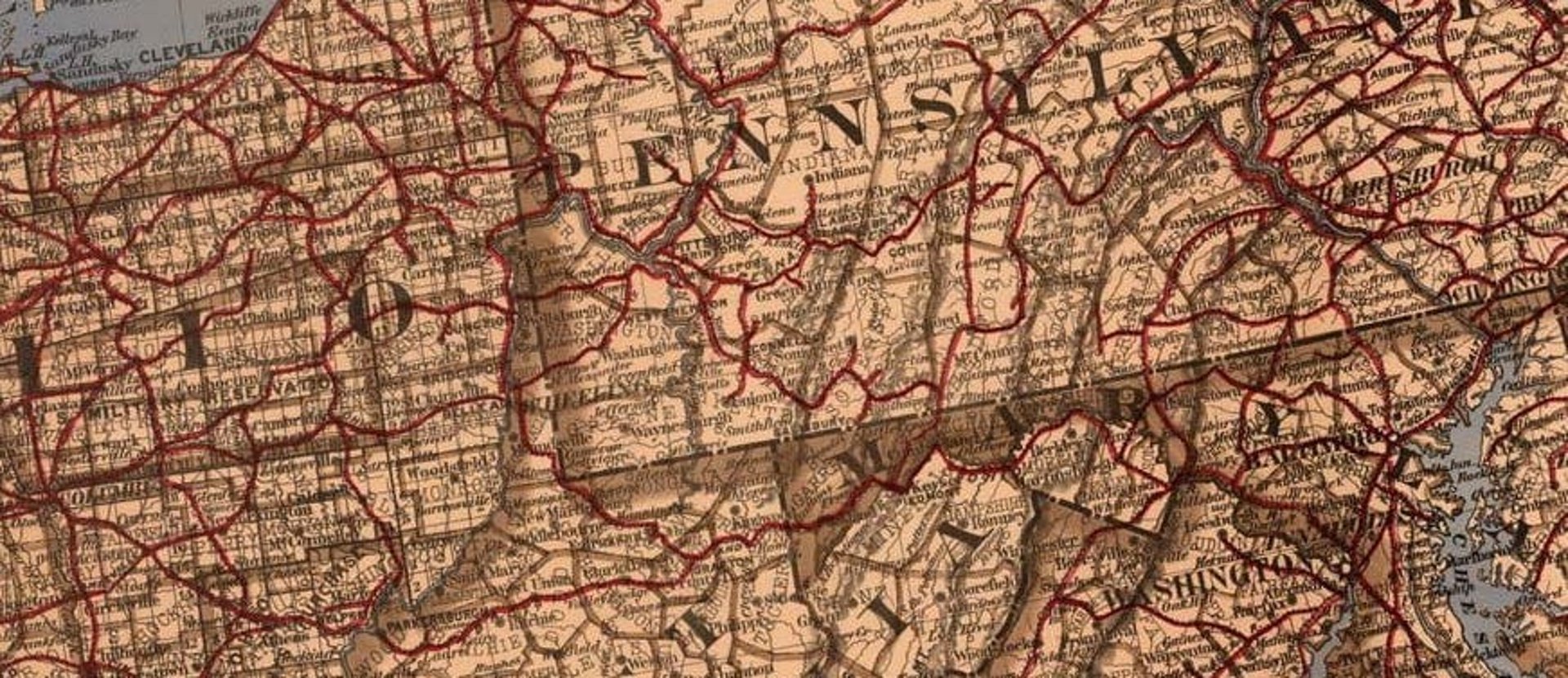 an abstract photo of a curved building with a blue sky in the background