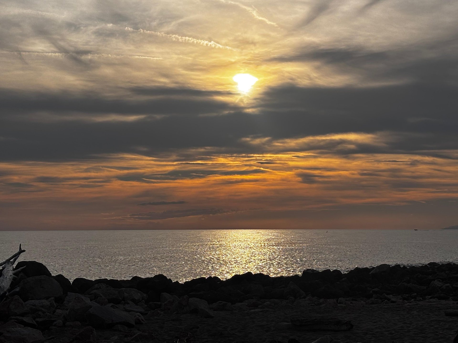 an abstract photo of a curved building with a blue sky in the background