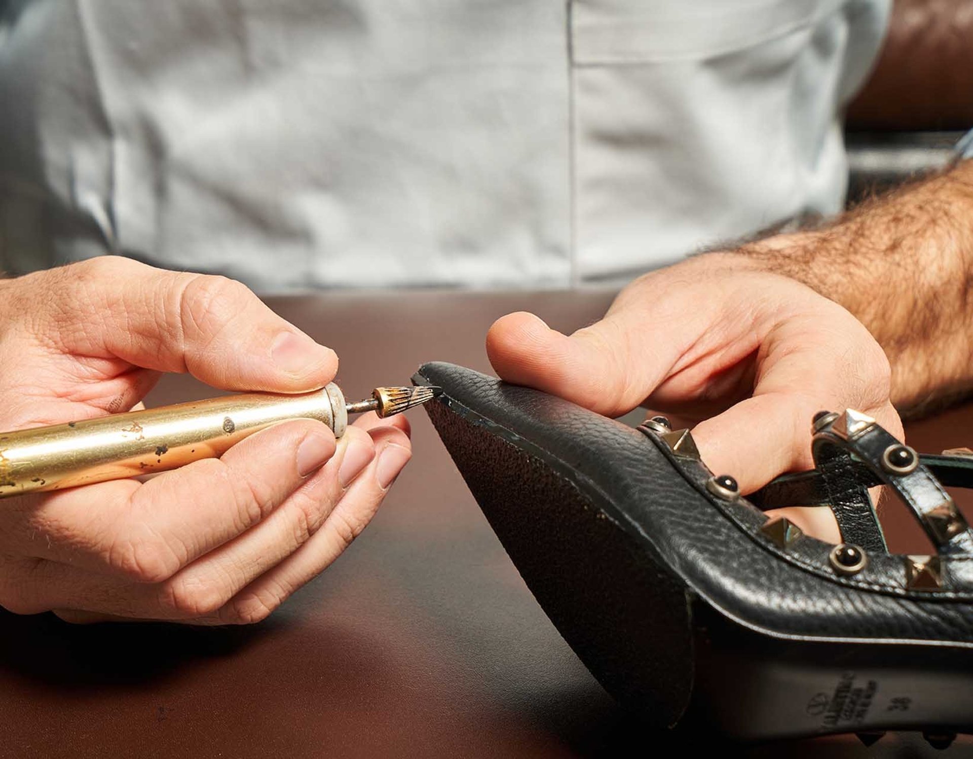 person holding knitted textiles