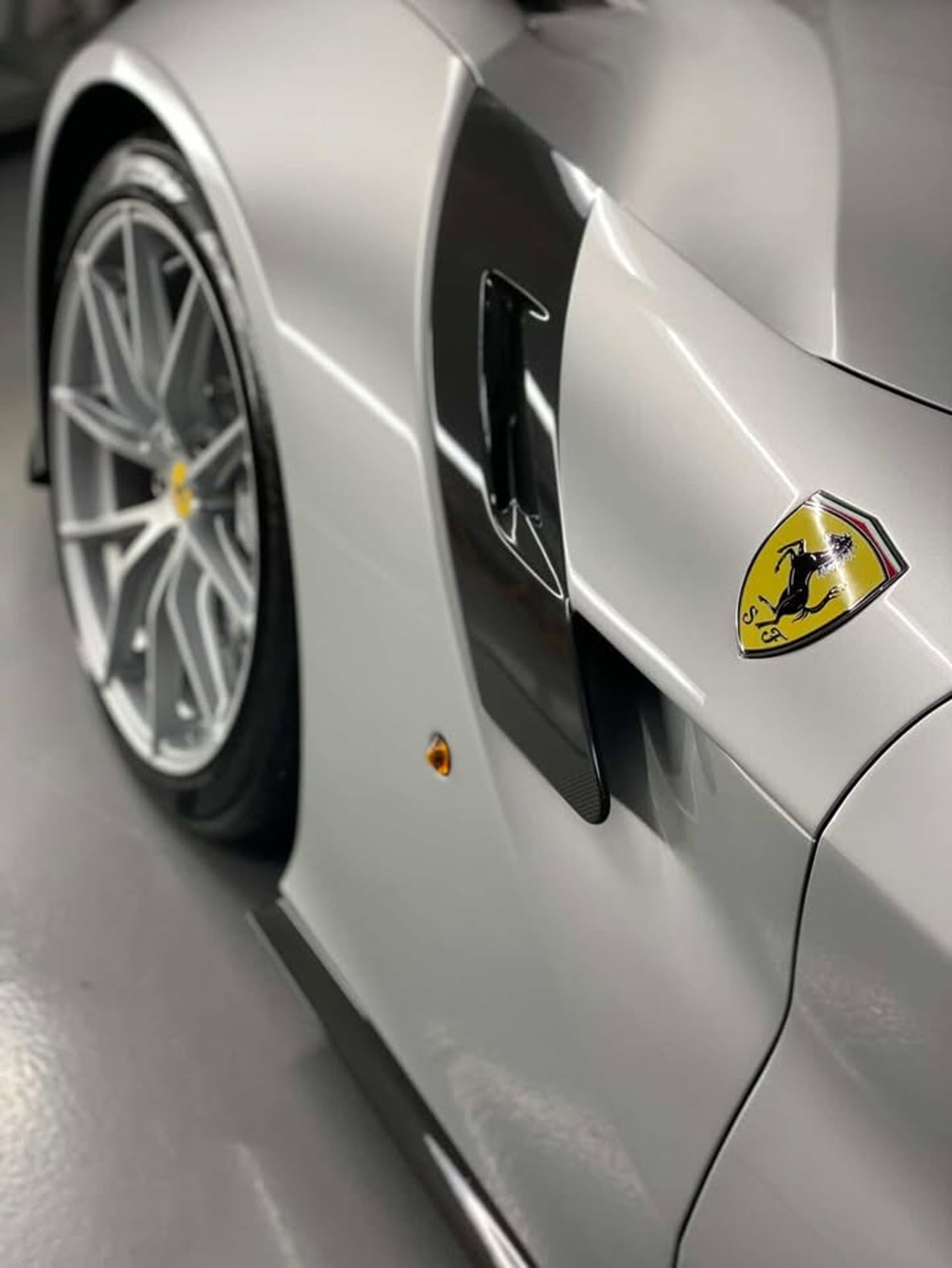 an abstract photo of a curved building with a blue sky in the background