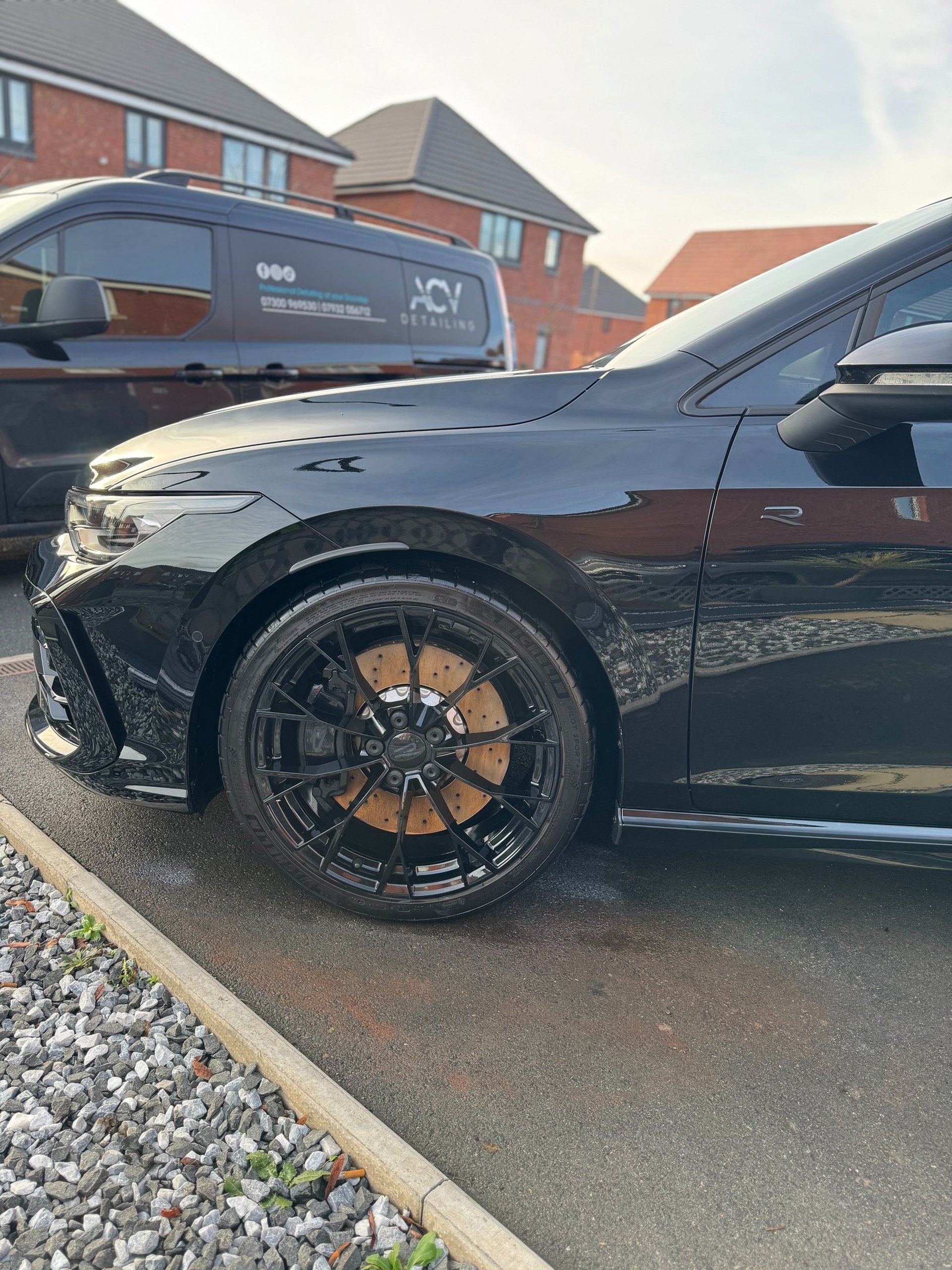 an abstract photo of a curved building with a blue sky in the background