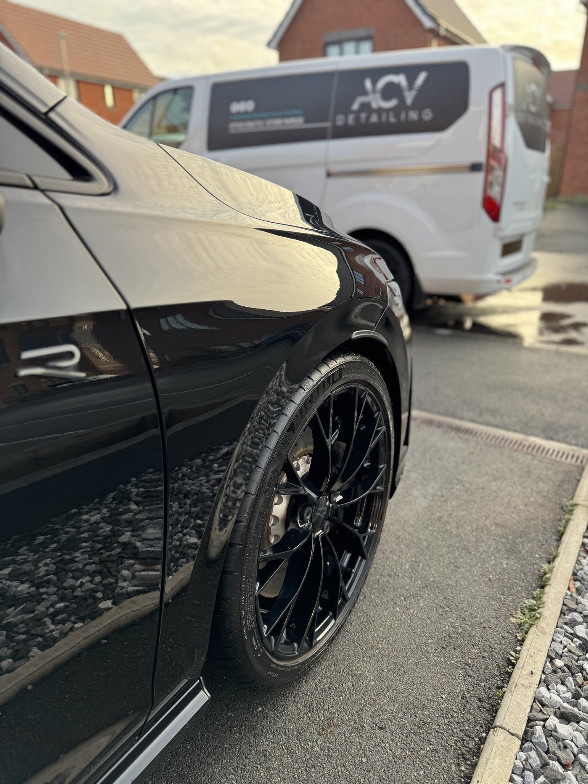 an abstract photo of a curved building with a blue sky in the background