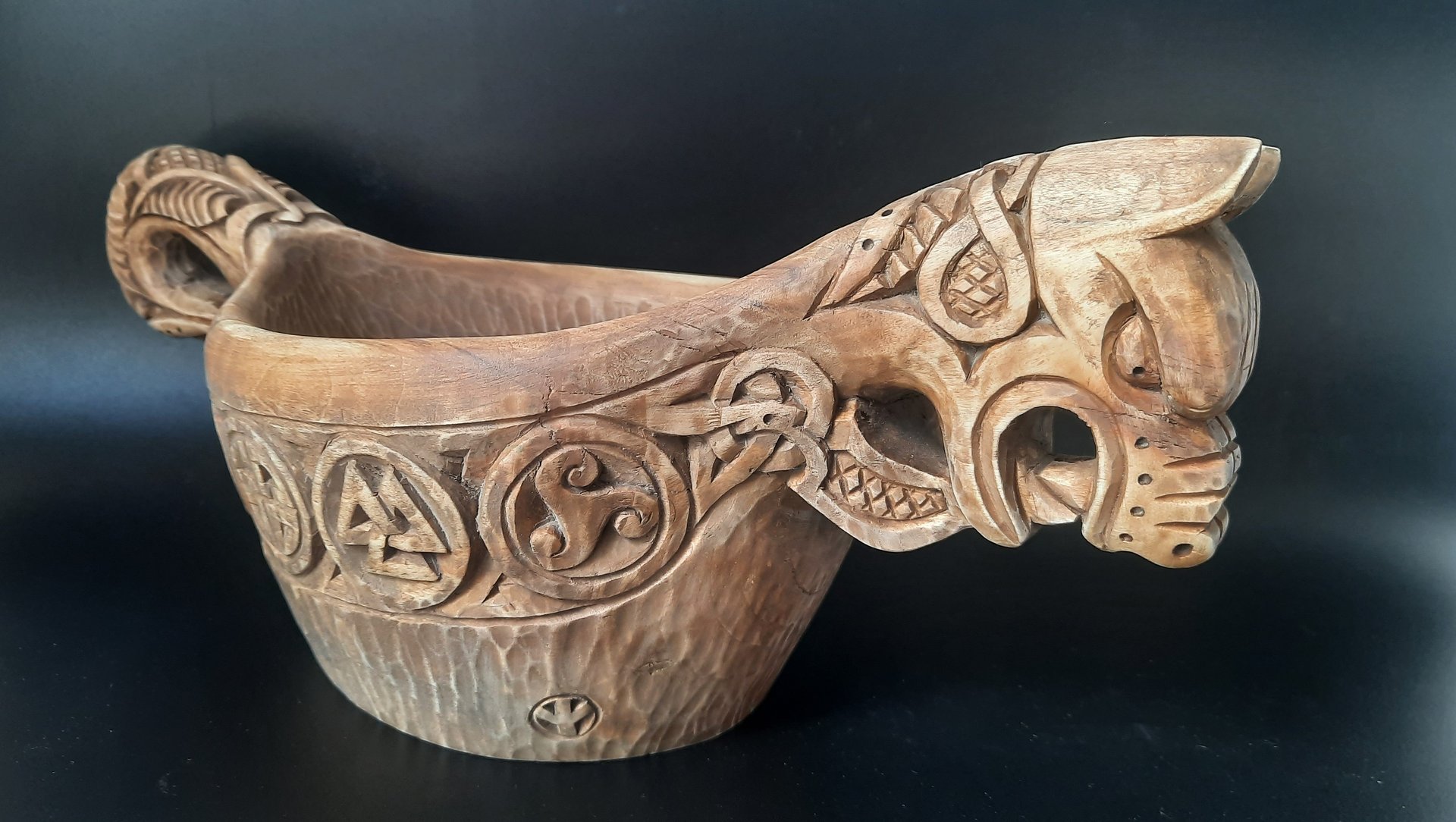 an abstract photo of a curved building with a blue sky in the background